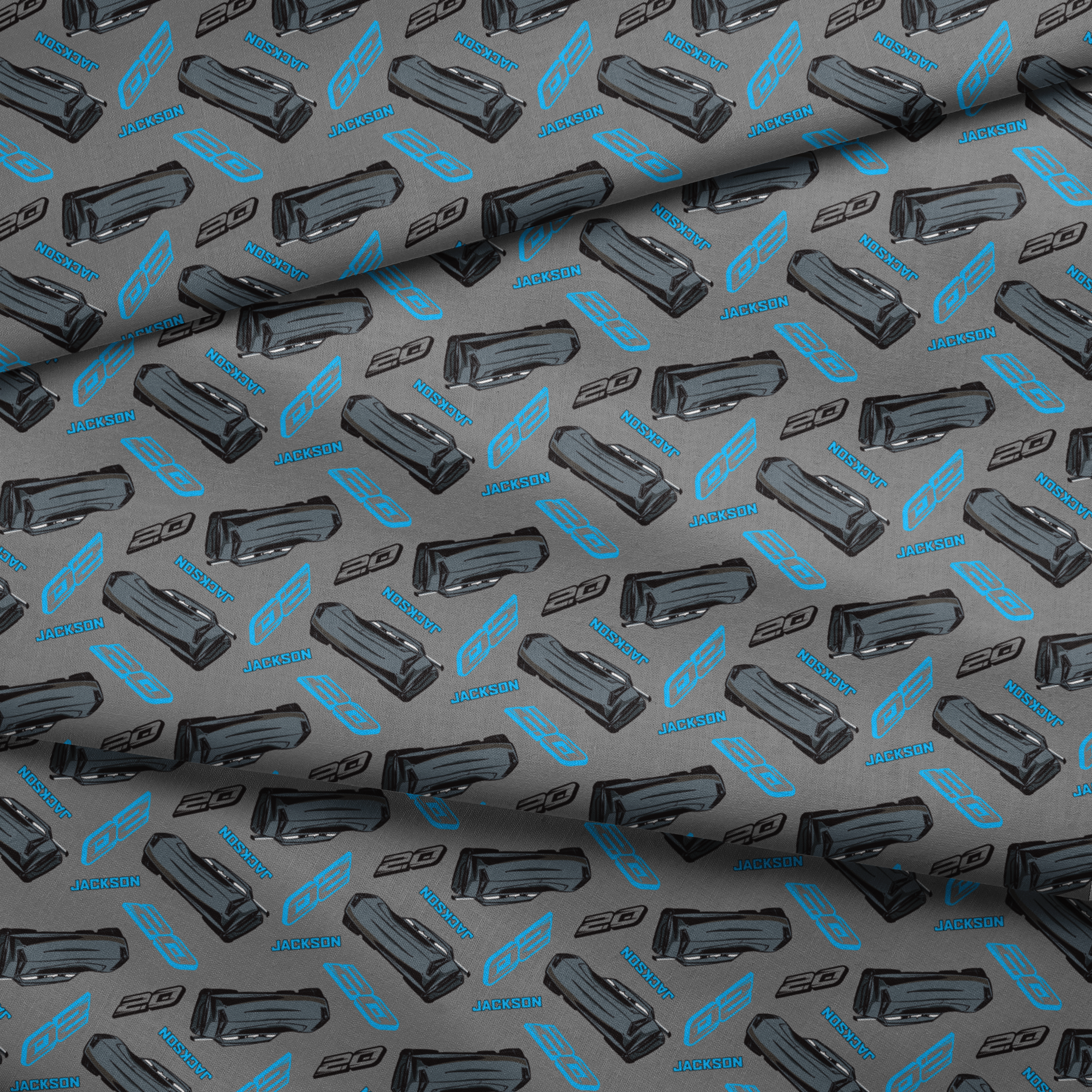 Dark gray background with scattered black car parts and blue "JACKSON" text and stylized logos in a repeating pattern fabric fold mockup