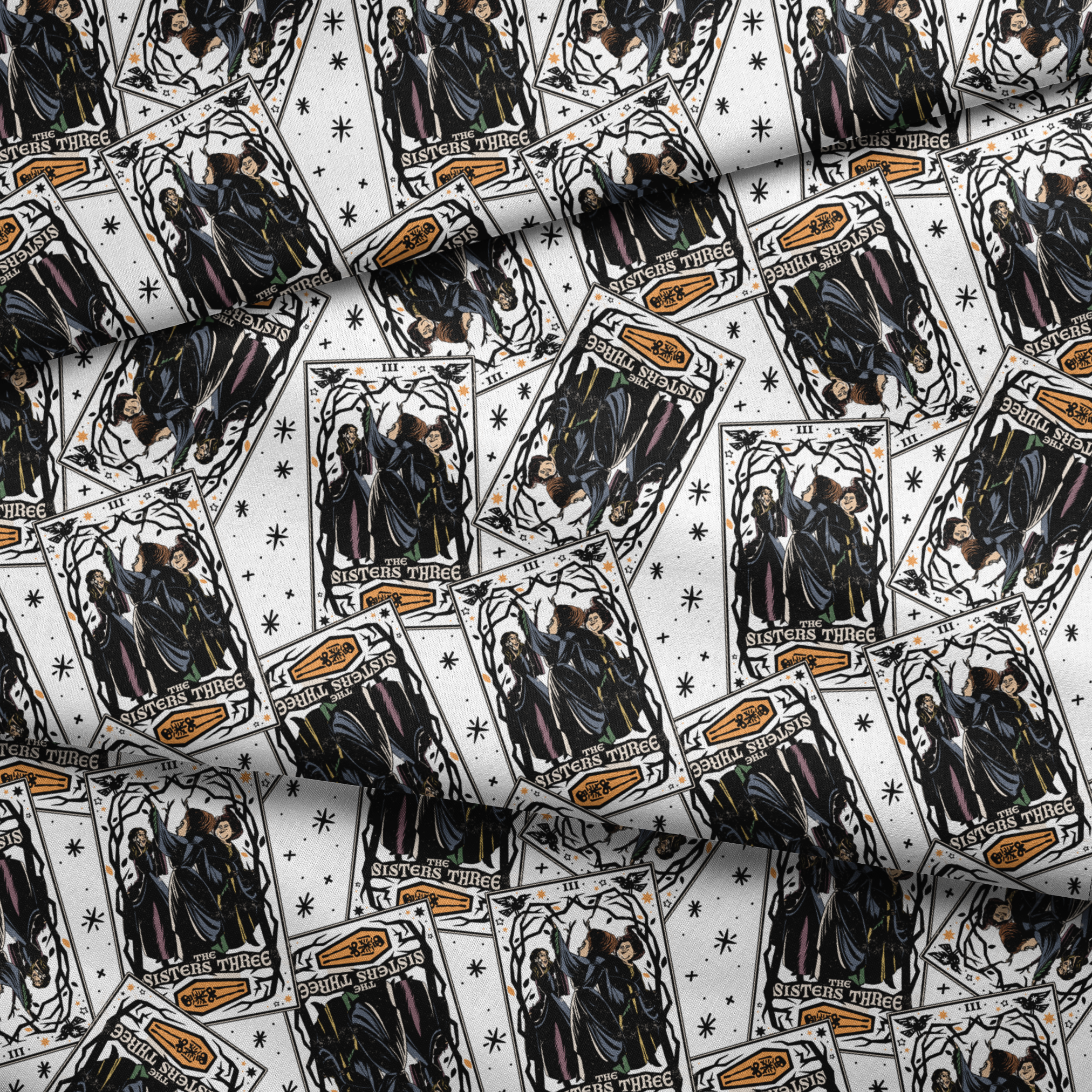 Scattered Hocus Pocus cards showing robed figures against white background with stars fabric fold mockup