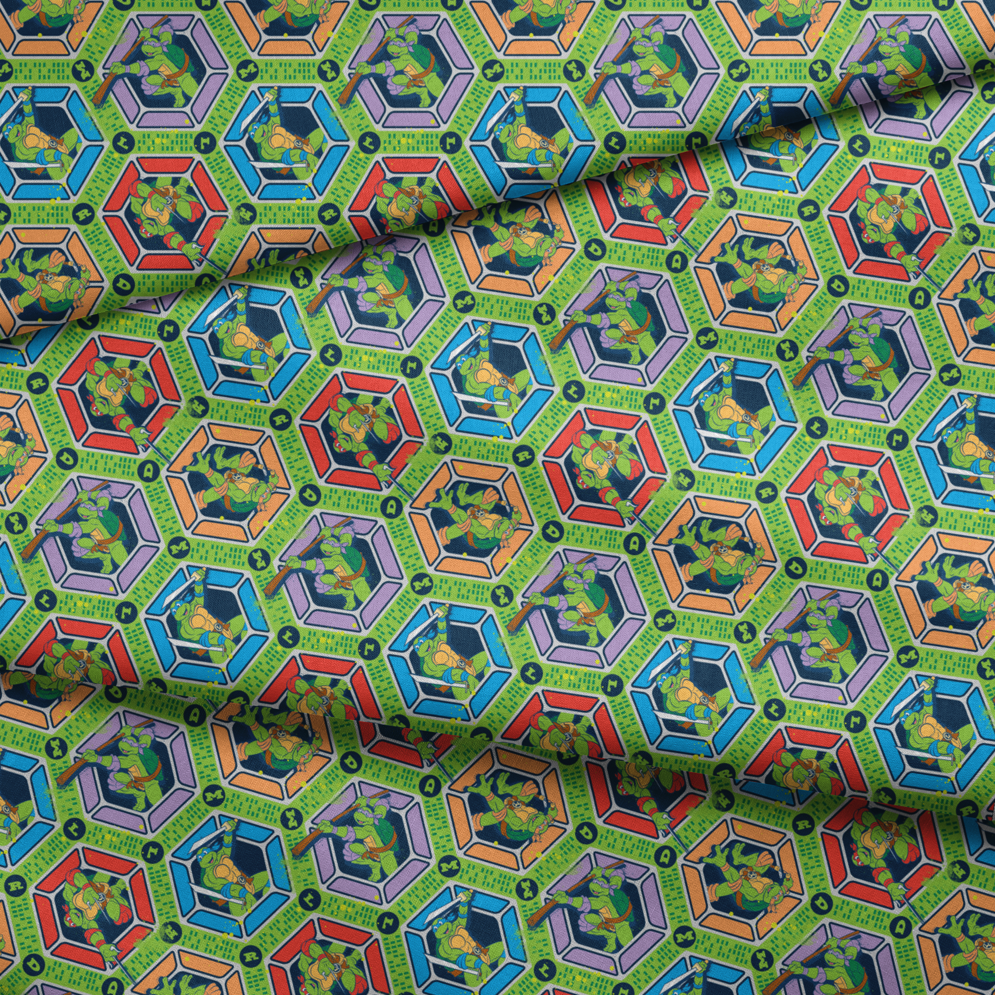Colorful hexagonal pattern featuring the Teenage Mutant Ninja Turtles in action poses on green backgrounds with digital text elements fabric fold mockup