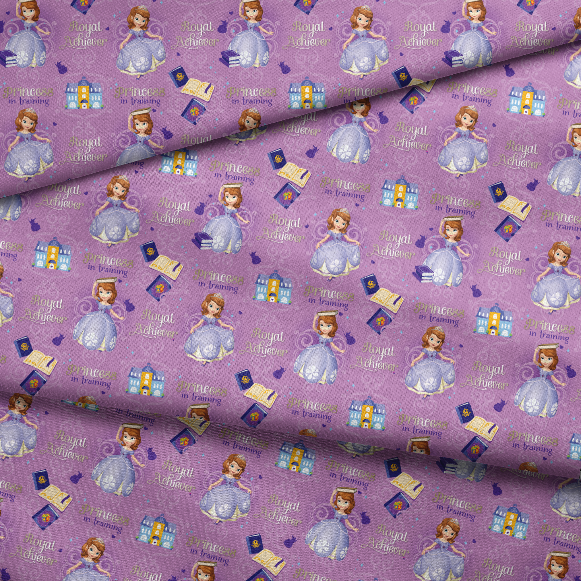 Princess Sofia pattern with "Royal Achiever" and "Princess in Training" text, purple background with castles and books fabric fold mockup