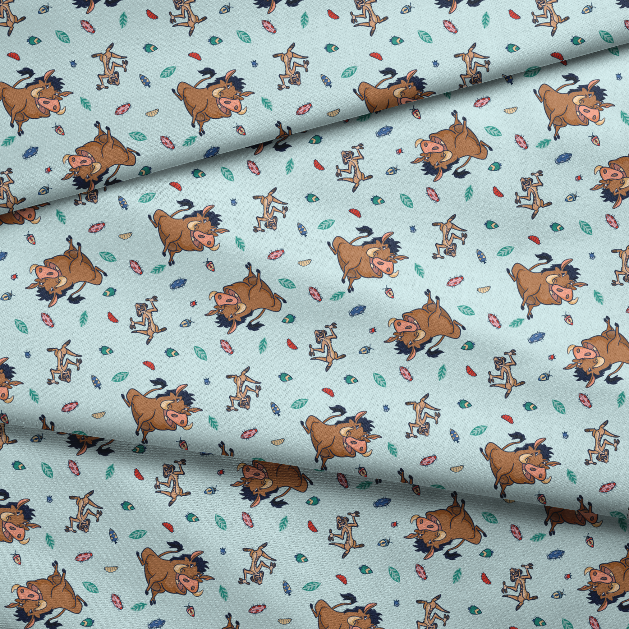 Lion King characters and colorful leaves scattered on light blue background in playful pattern fabric fold mockup