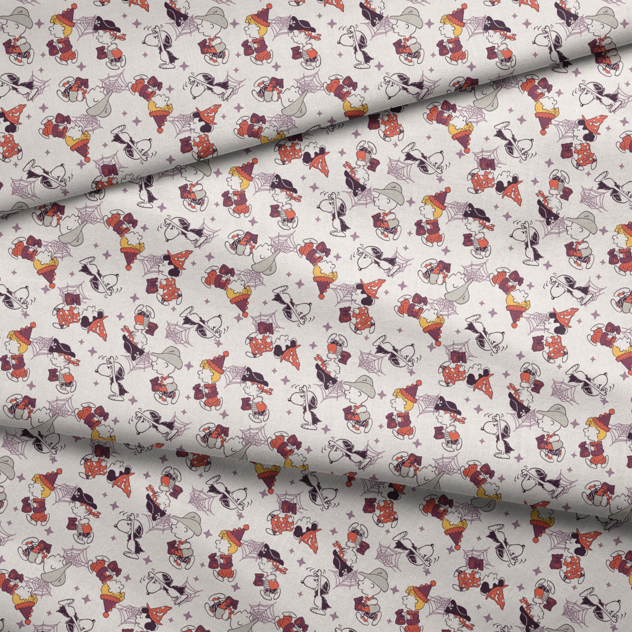 Peanuts characters in Halloween costumes including Snoopy, Charlie Brown, and friends on white background fabric fold mockup