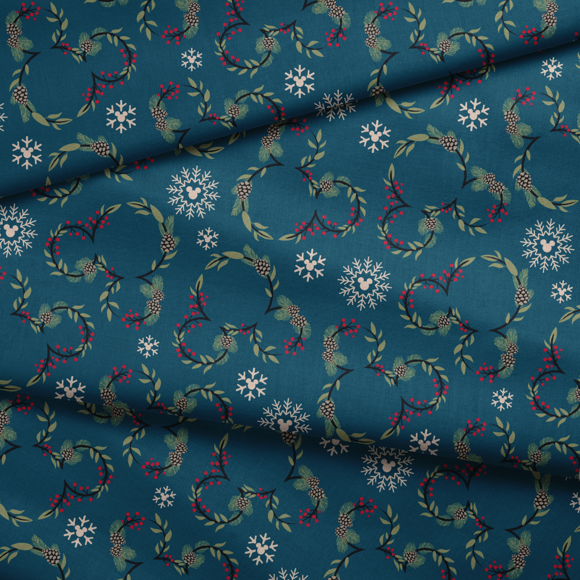 Holiday pattern with circular wreaths, white snowflakes, and botanical elements on teal background fabric fold mockup