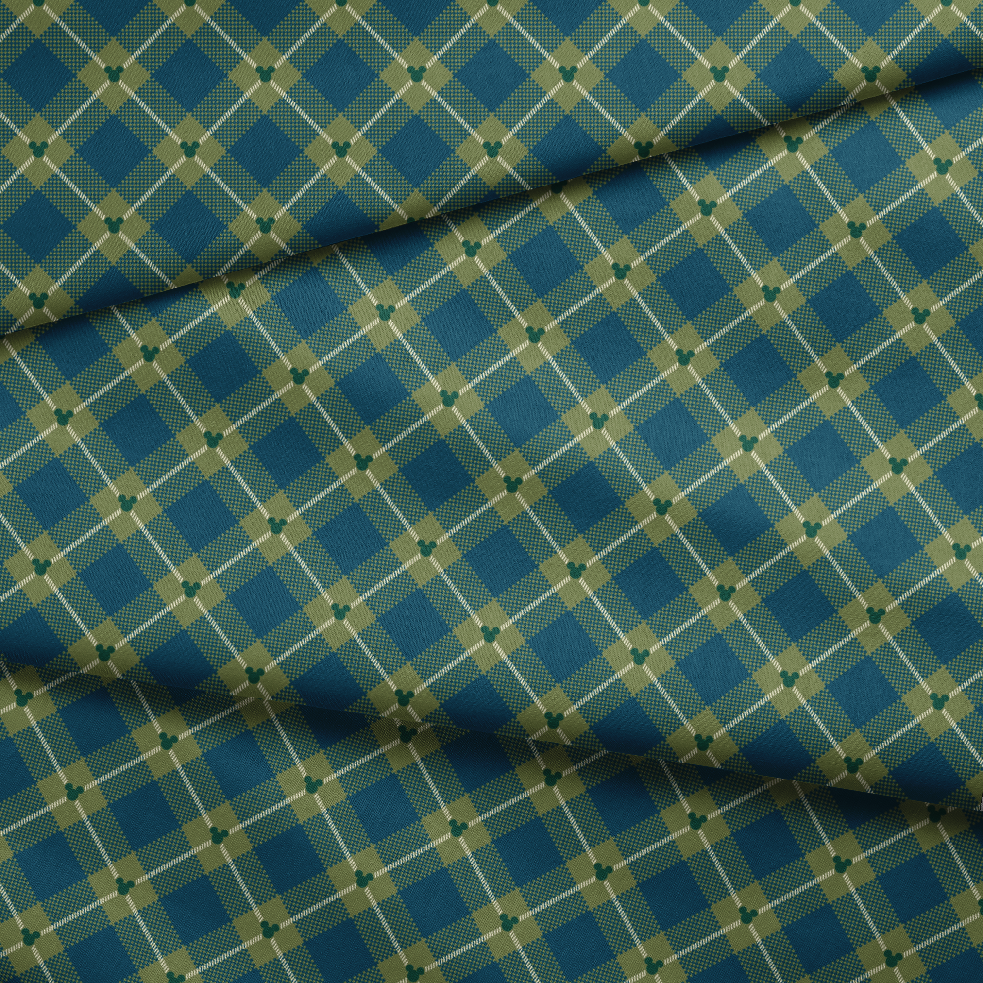Geometric plaid pattern with teal and olive green diamonds, white diagonal stripes and checkered textures fabric fold mockup