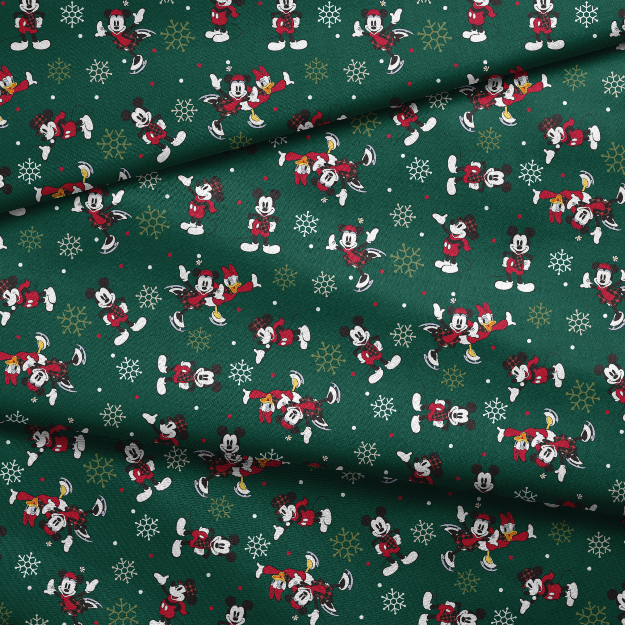 Mickey Mouse Christmas pattern with cartoon characters in winter outfits on green background with snowflakes fabric fold mockup