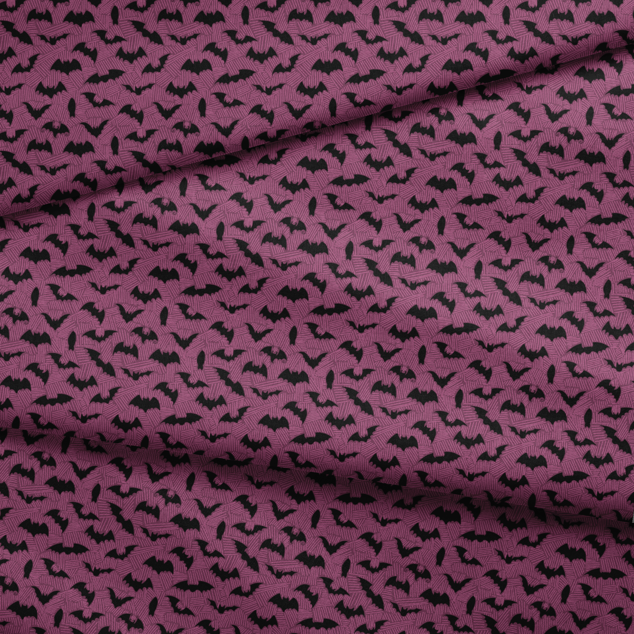 Black bat silhouettes scattered across a purple background with swirling line pattern fabric fold mockup