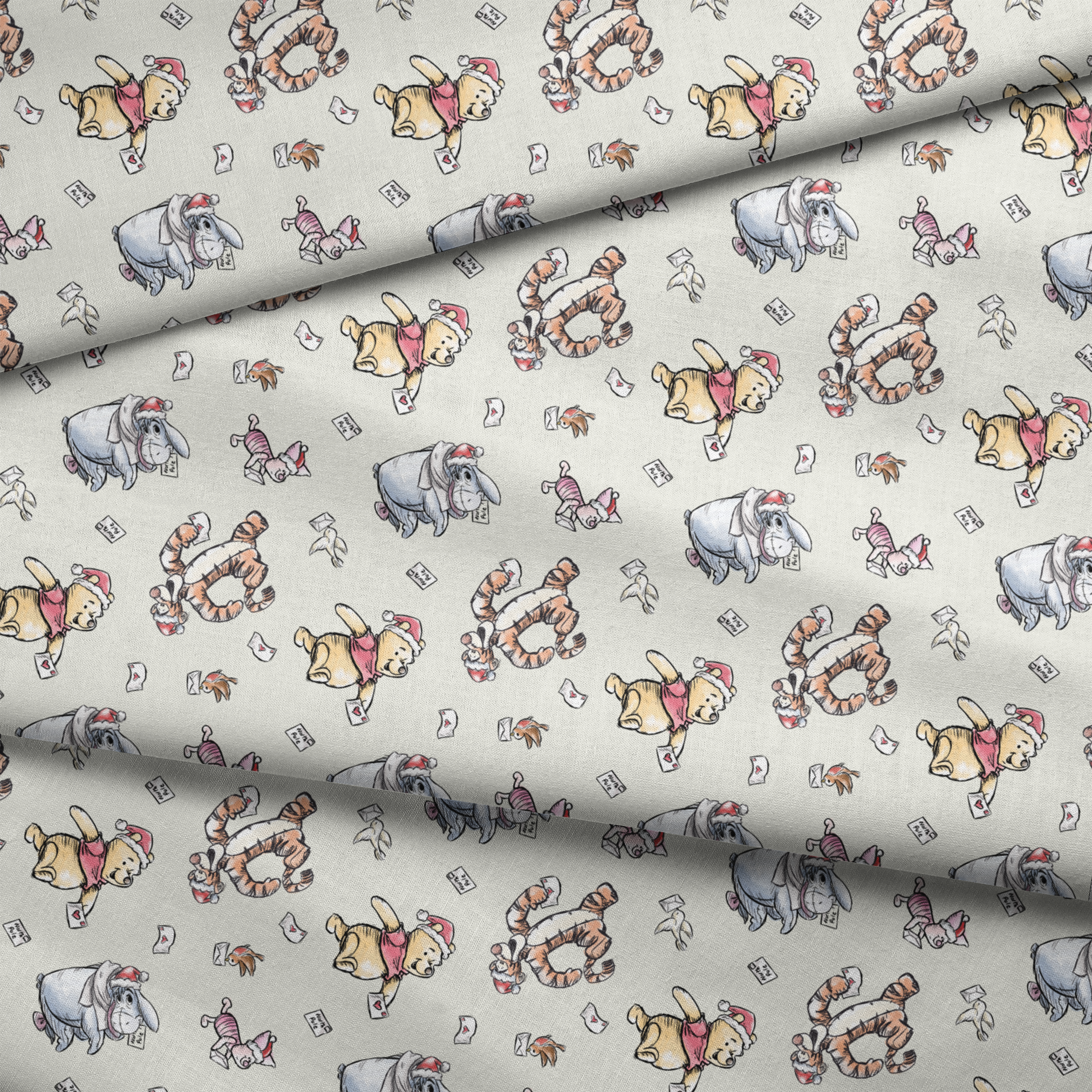 Whimsical cartoon characters in Santa hats on cream background with scattered letters fabric fold mockup