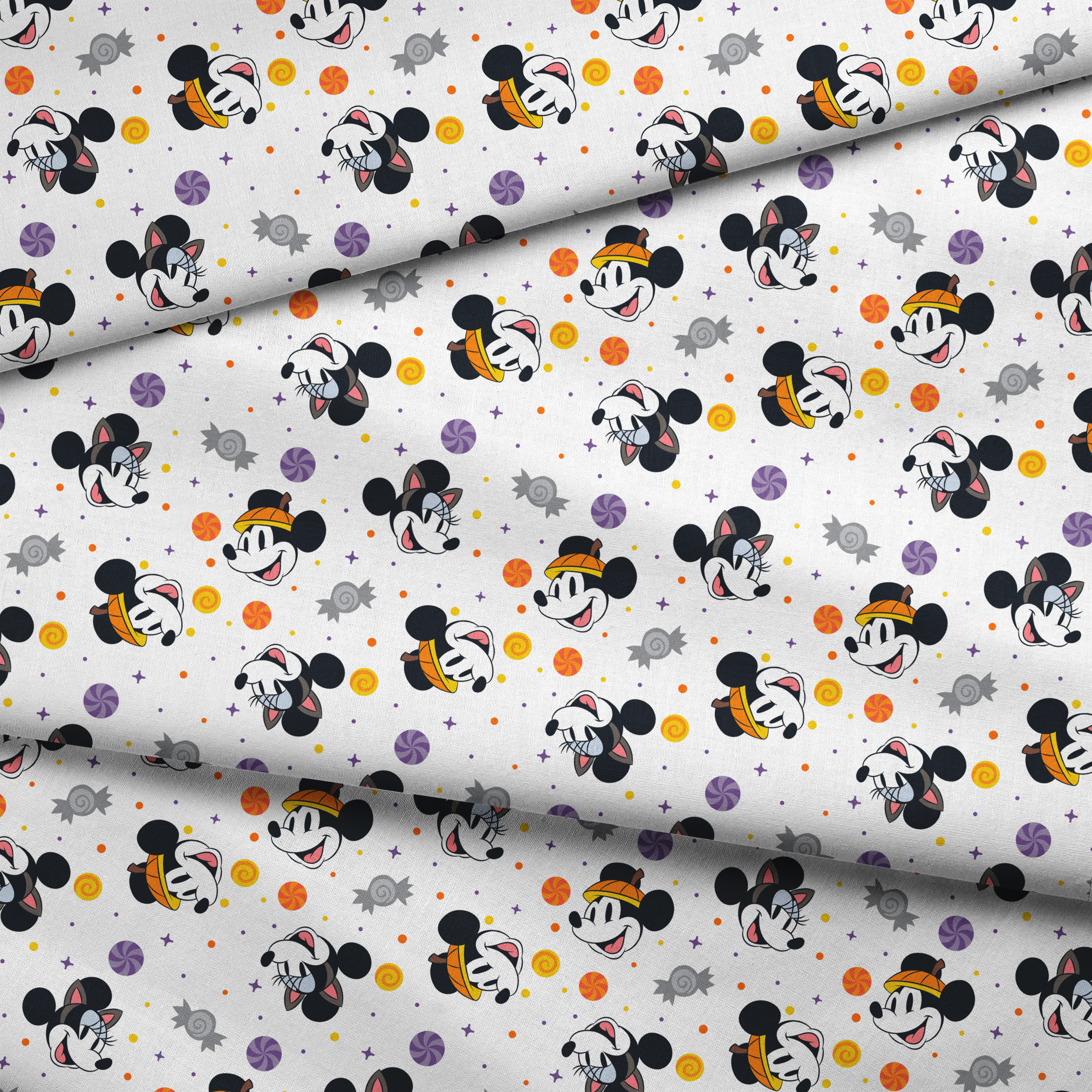 Mickey and Minnie Mouse cartoon heads scattered with wrapped candies and colorful dots on white background fabric fold mockup