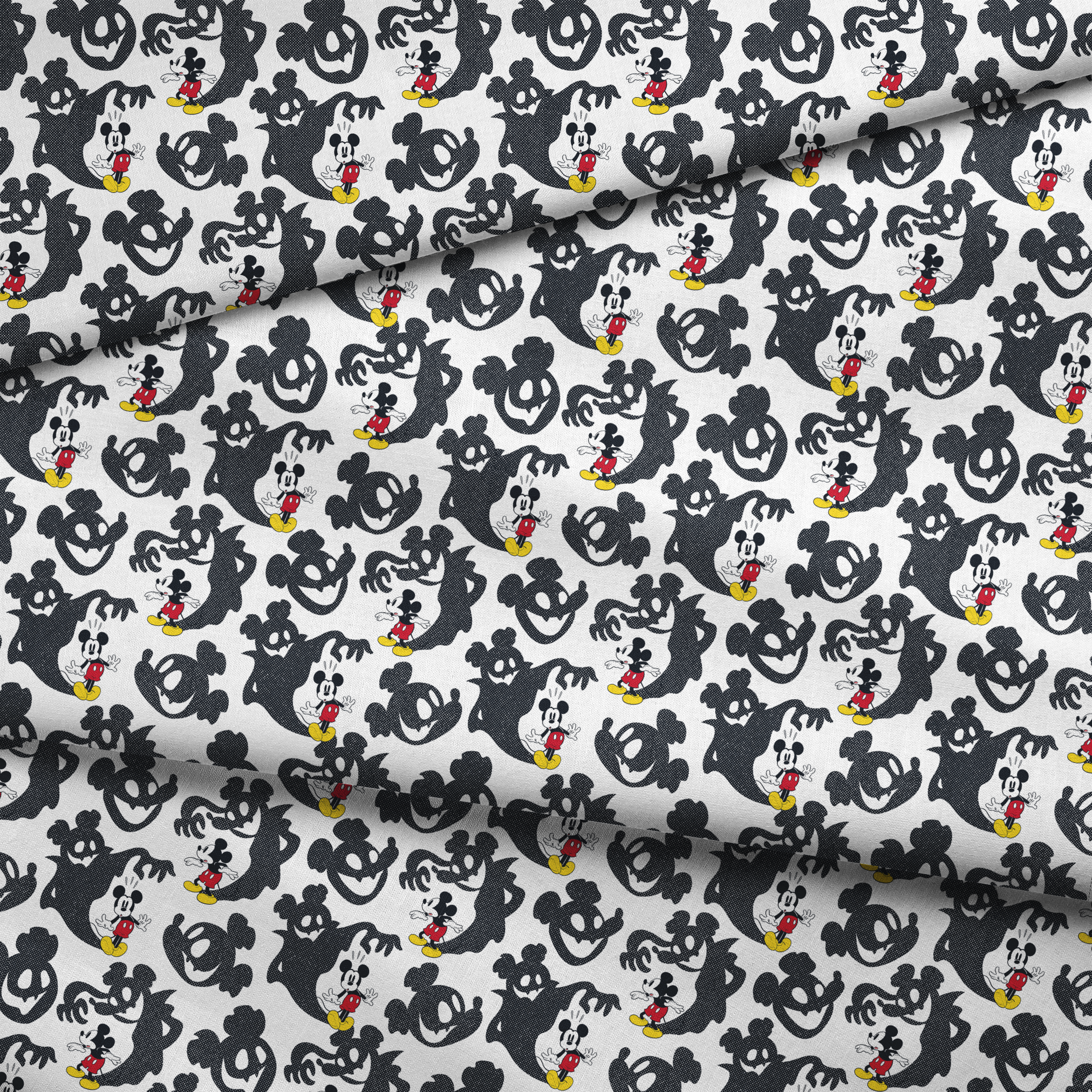 Mickey Mouse pattern with black ghost silhouettes on white background fabric fold mockup