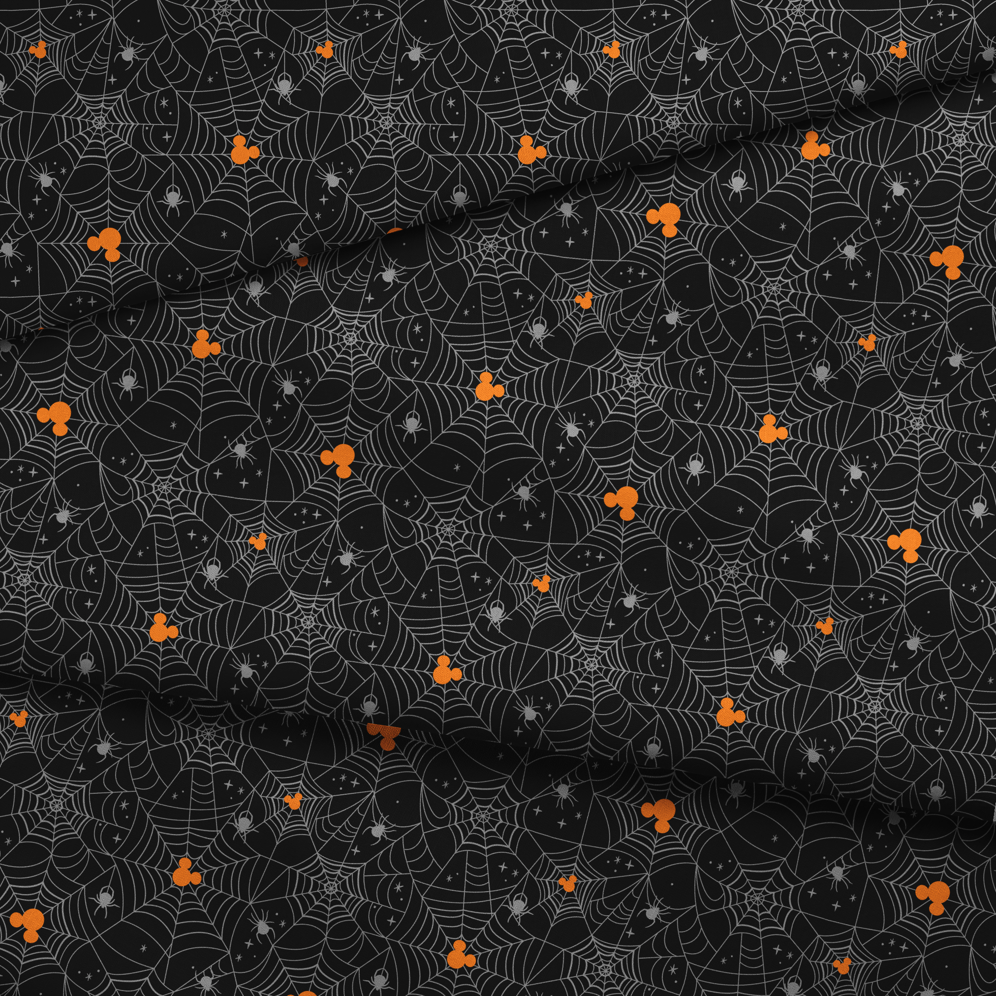 Spooky Halloween pattern with white spiderwebs, orange Mickey Mouse heads, and gray spiders on black background fabric fold mockup