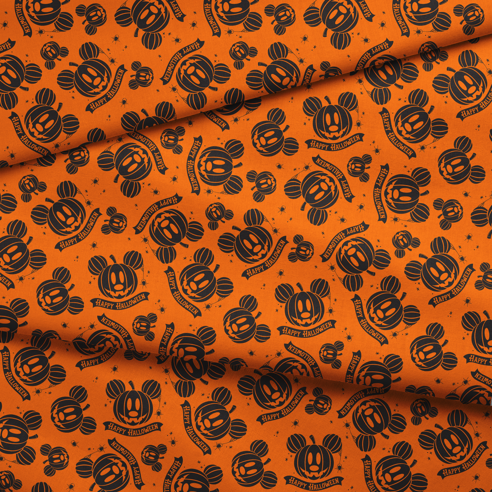 Halloween pattern with Disney-inspired jack-o'-lantern pumpkins and "Happy Halloween" text on bright orange background fabric fold mockup