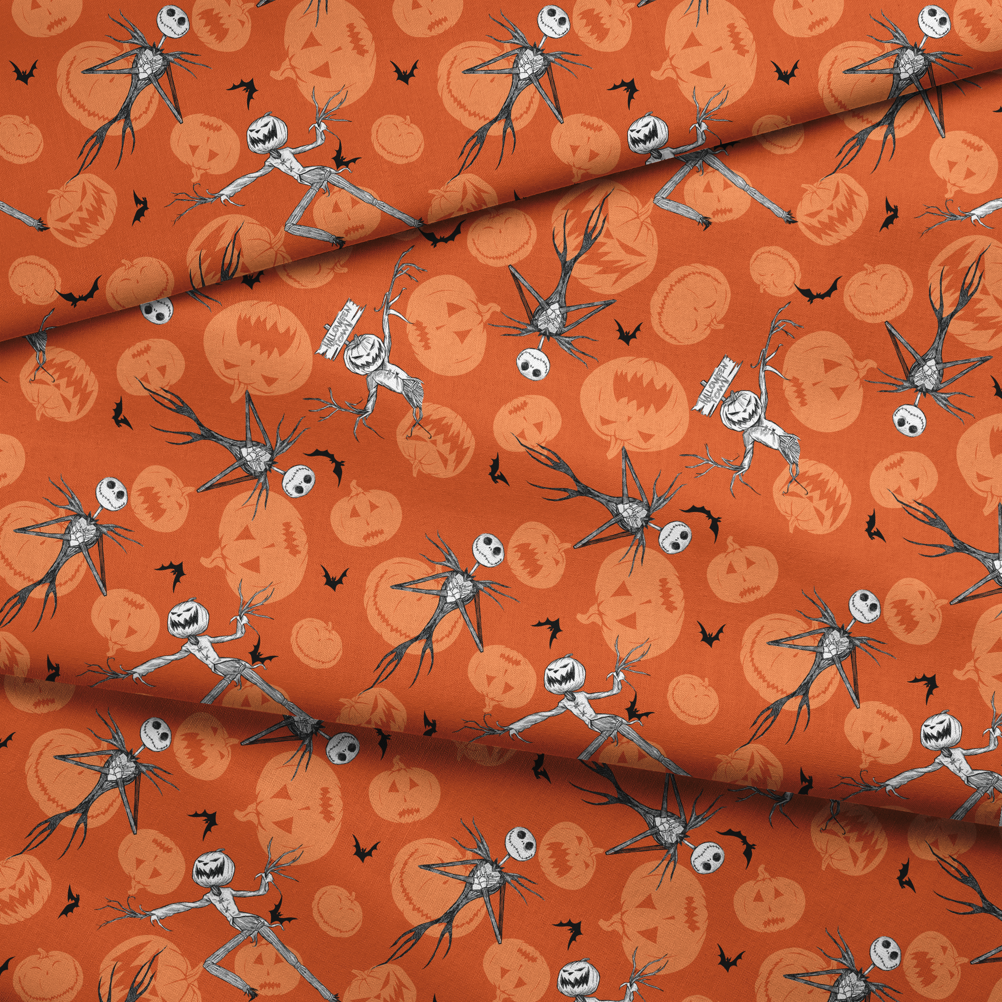 Nightmare Before Christmas pattern with Jack Skellington, bats, and jack-o'-lantern silhouettes on orange background fabric fold mockup