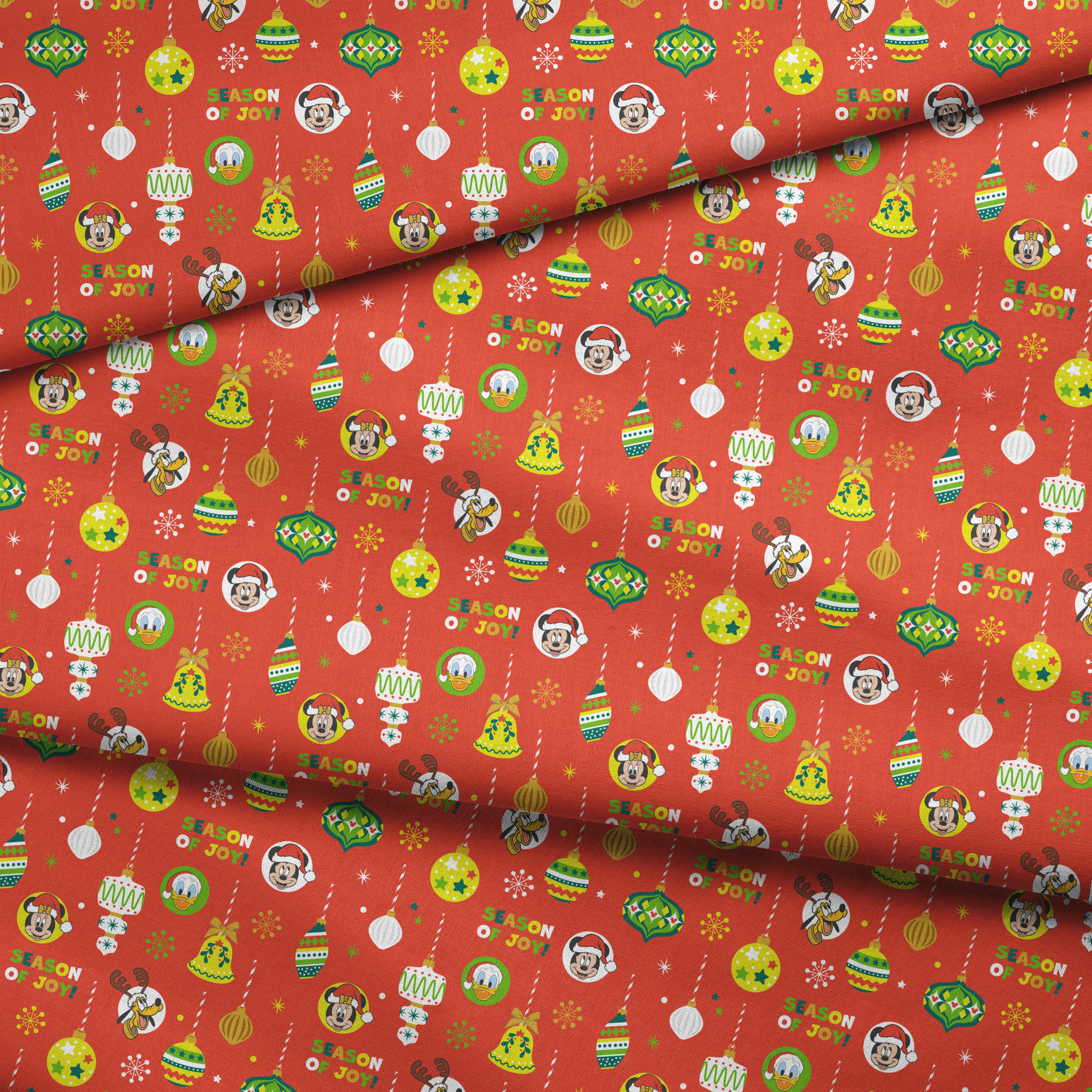 Christmas ornament pattern with colorful baubles, bells, snowflakes and Mickey Mouse characters on bright red background fabric fold mockup