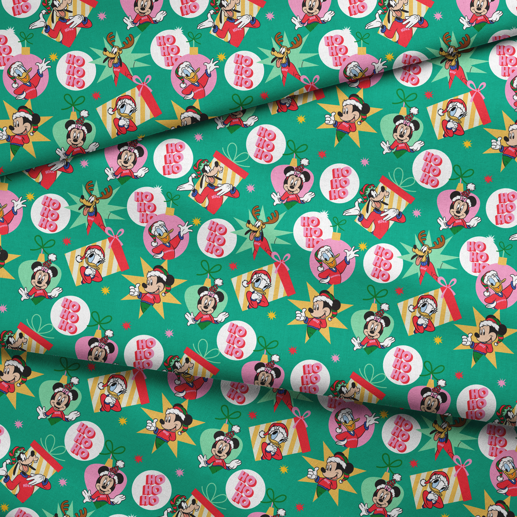 Festive Disney characters on green holiday pattern with "Ho Ho Ho" text and Christmas ornaments fabric fold mockup