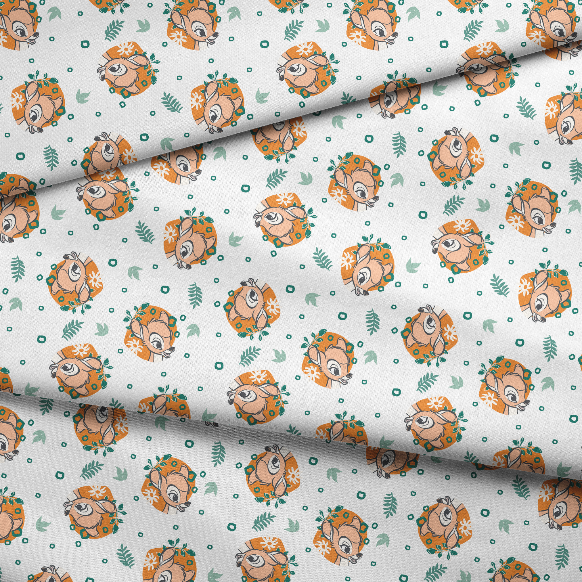 Disney’s Bambi illustrated in golden-orange floral medallions with green leaves and scattered geometric accents on a white background. fabric fold mockup