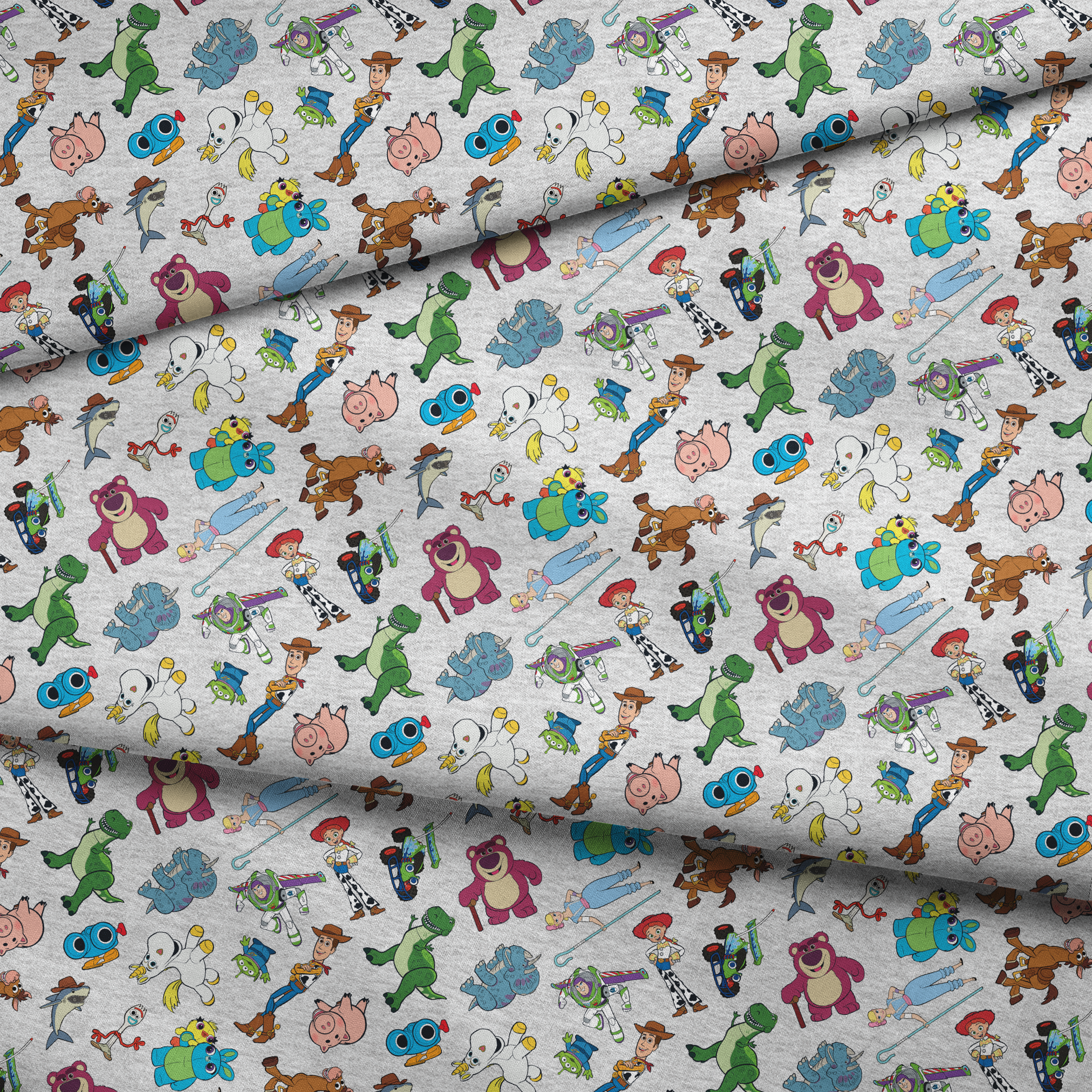 Colorful pattern of various animated Toy Story characters on a light speckled background fabric fold mockup