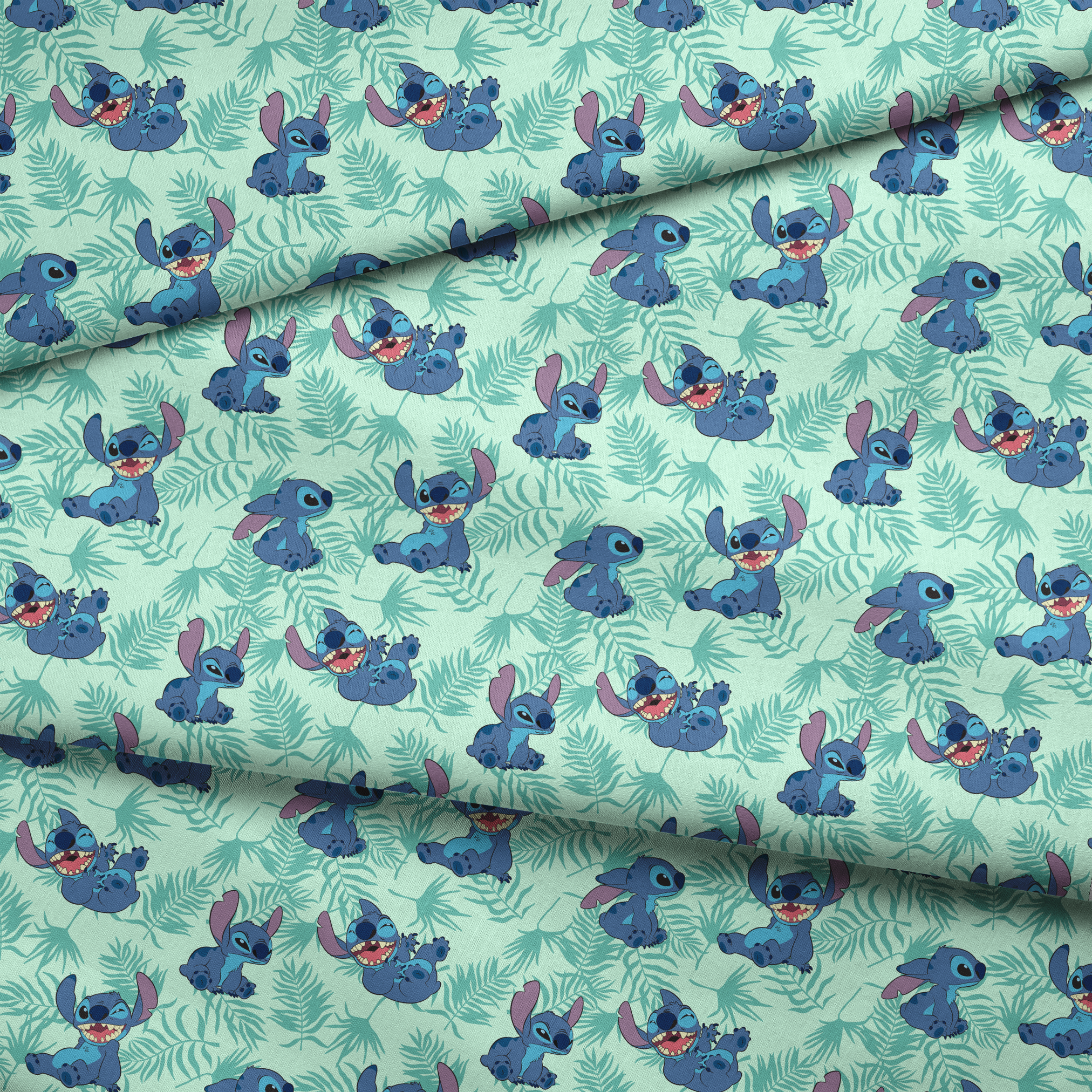 Blue cartoon alien character Stitch in various playful poses against mint green tropical leaf pattern background fabric fold mockup