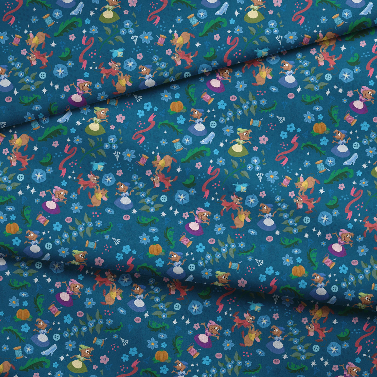 Colorful fairy tale pattern with mice, glass slippers, pumpkins, and floral elements on deep blue background fabric fold mockup