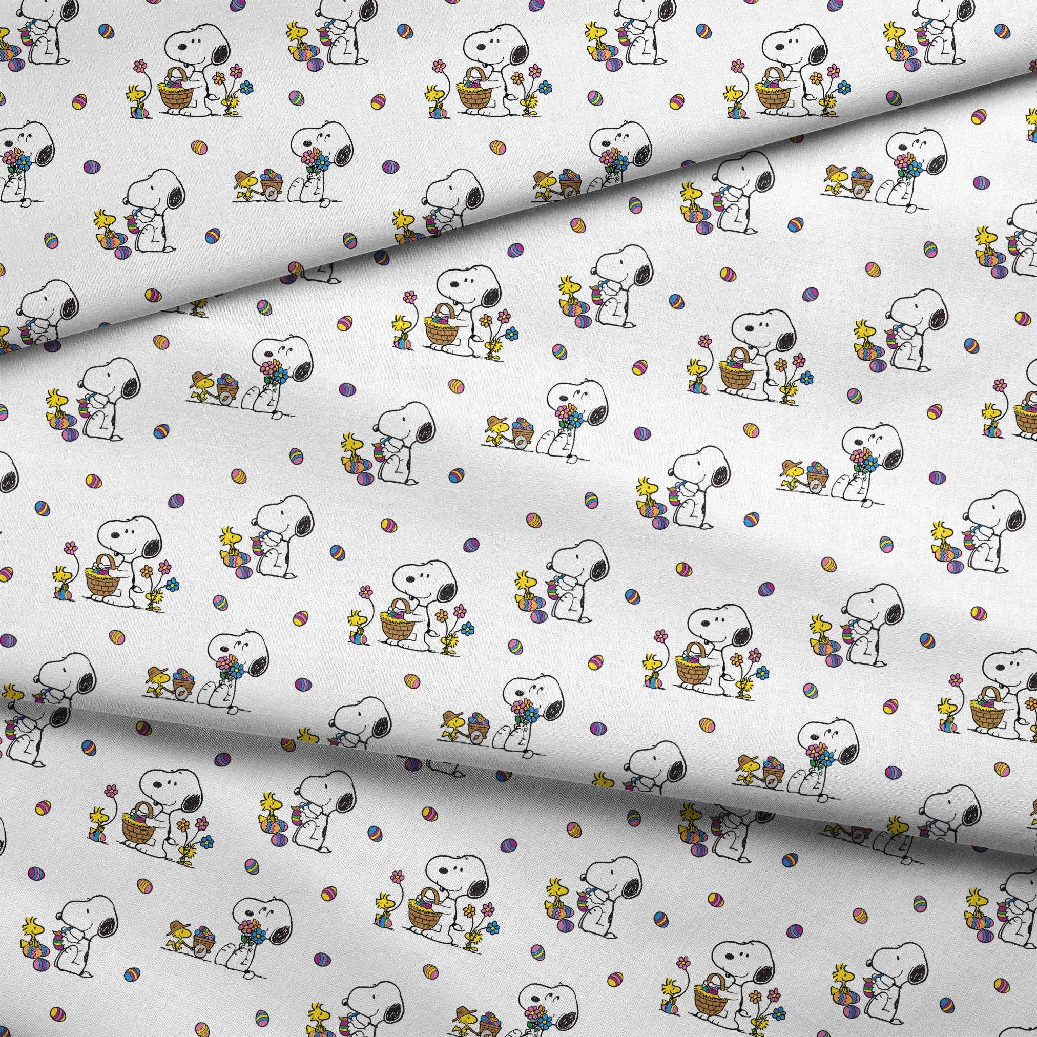 Cartoon pattern with Snoopy and Woodstock celebrating Easter with colorful eggs and baskets on white background fabric fold mockup