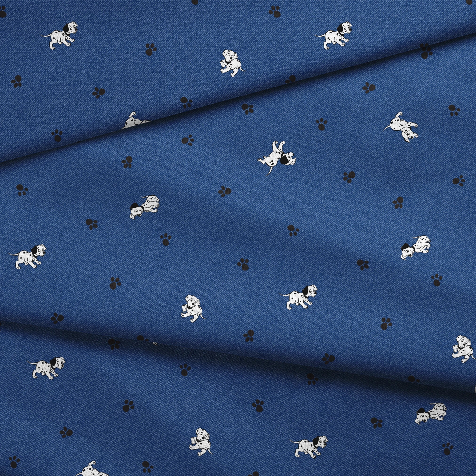 Blue background with small white cartoon-style space astronauts and black paw prints scattered across the pattern fabric fold mockup