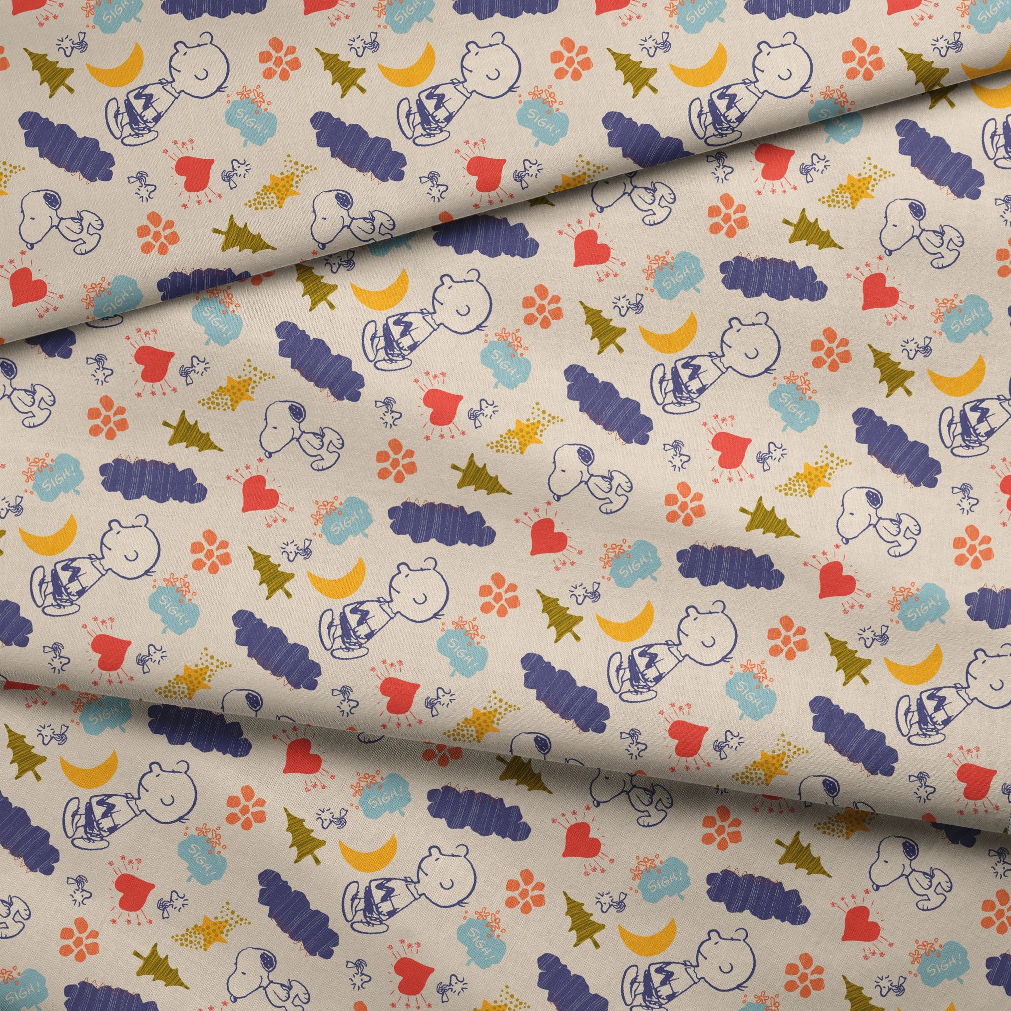 Whimsical Peanuts pattern with trees, clouds, moon, and birds in blue, red, green, and yellow on cream background. fabric fold mockup