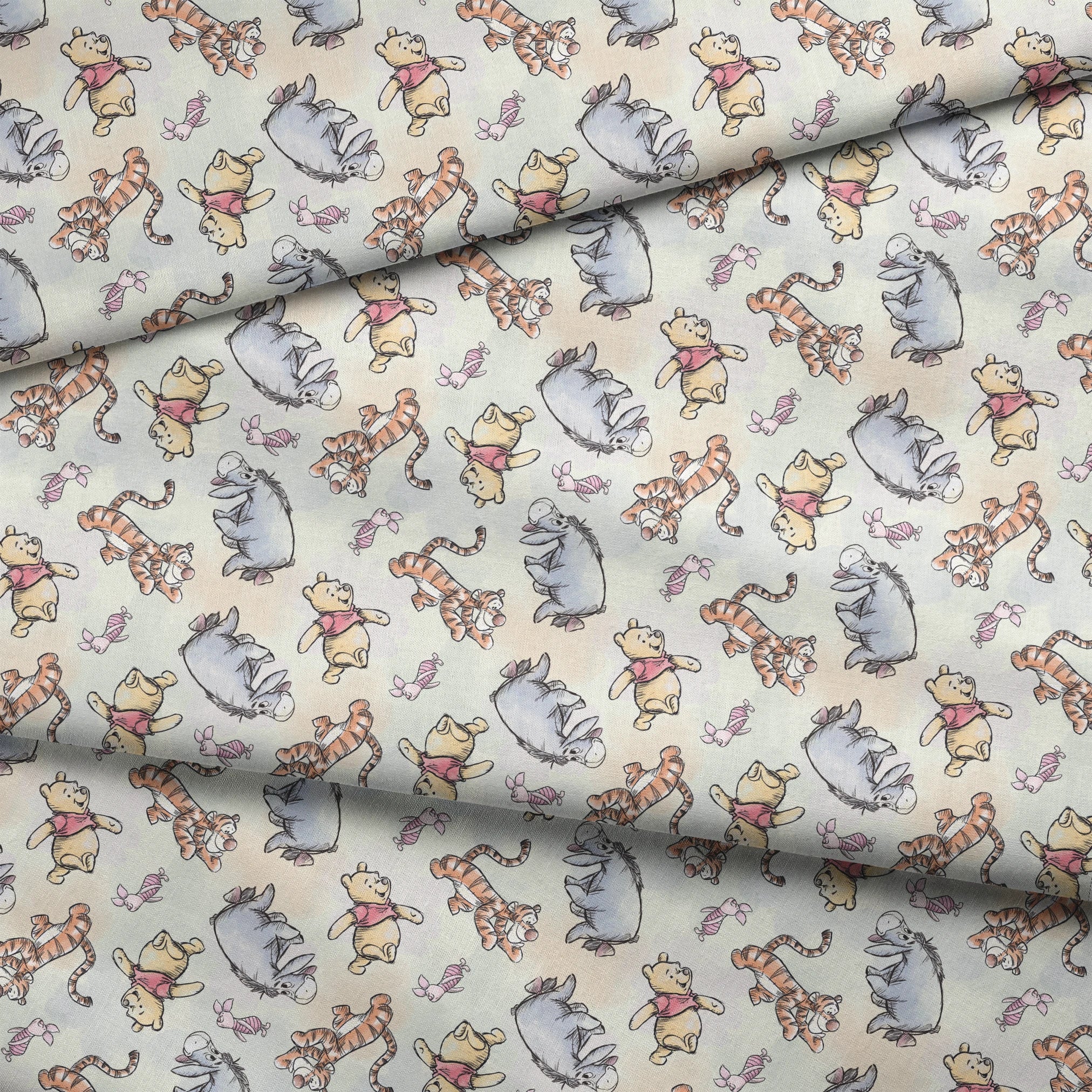 Whimsical pattern featuring cartoon bears in red shirts with bouncing tigers and small pink chara... fabric fold mockup