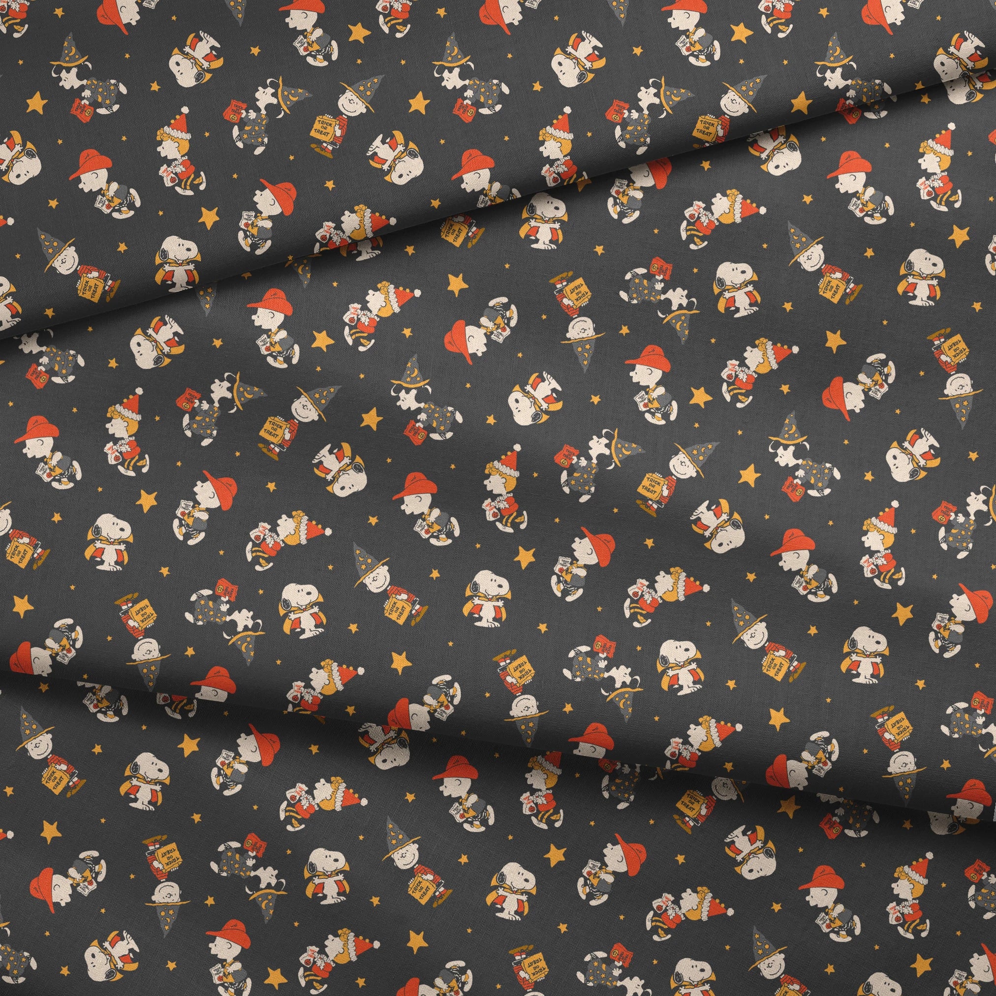 Snoopy cartoon pattern on dark gray background with characters in Halloween costumes and golden stars fabric fold mockup
