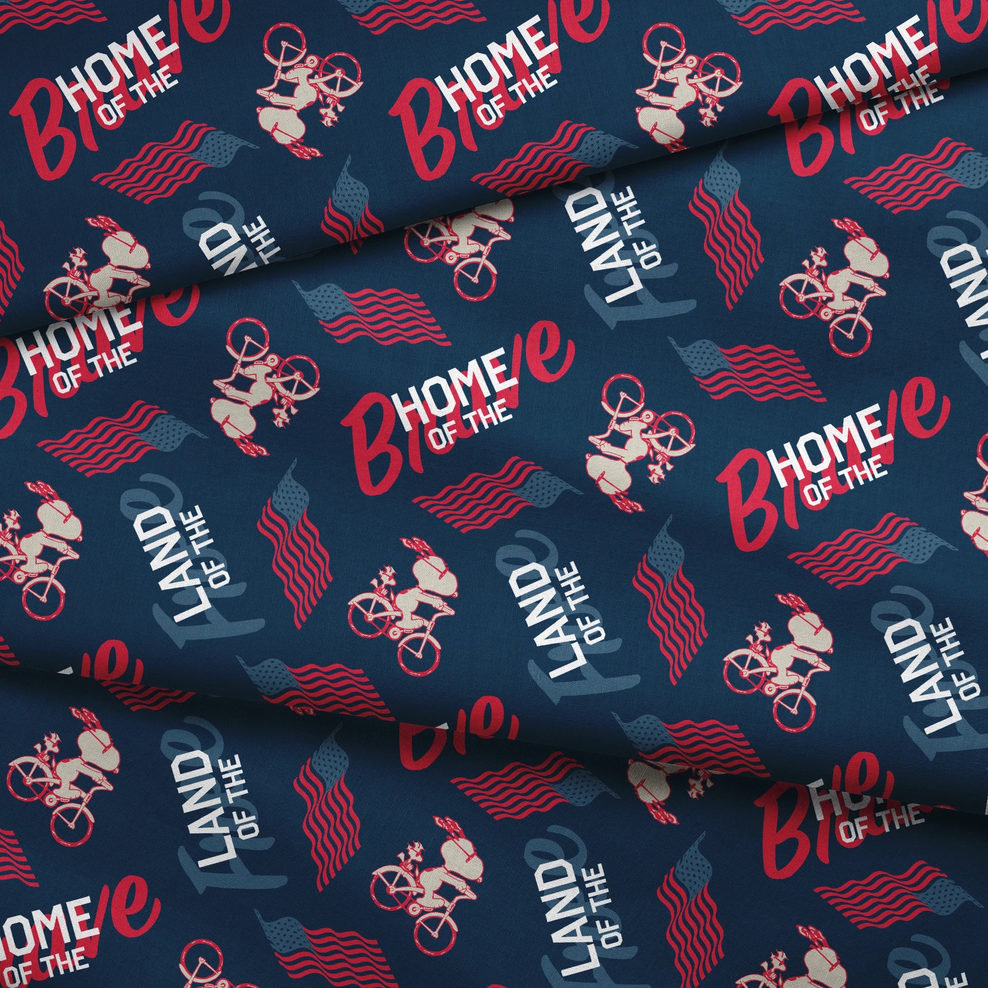 Repeating Peanuts "Home of the Brave" text pattern with bicycles on navy blue background with red wavy lines fabric fold mockup