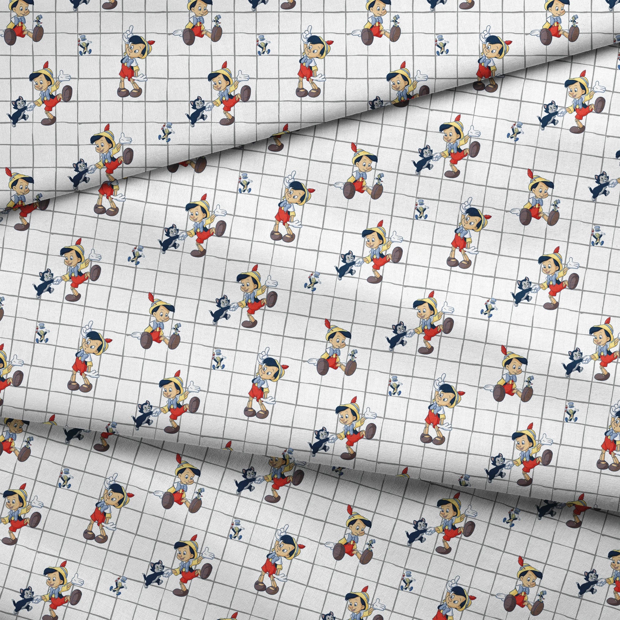 Classic cartoon puppets with red shorts, yellow hats on white grid pattern with small black cat figures fabric fold mockup