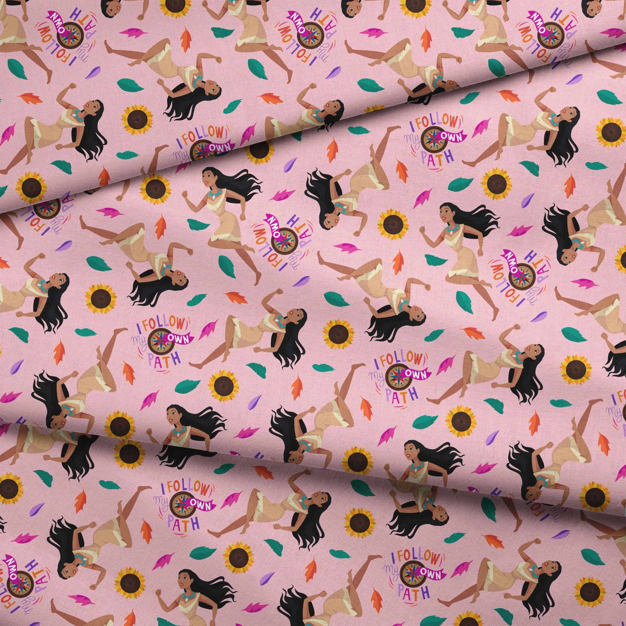 Colorful pattern with figures in relaxed poses, sunflowers, and text "Hi I Follow My Own Path" on pink background fabric fold mockup