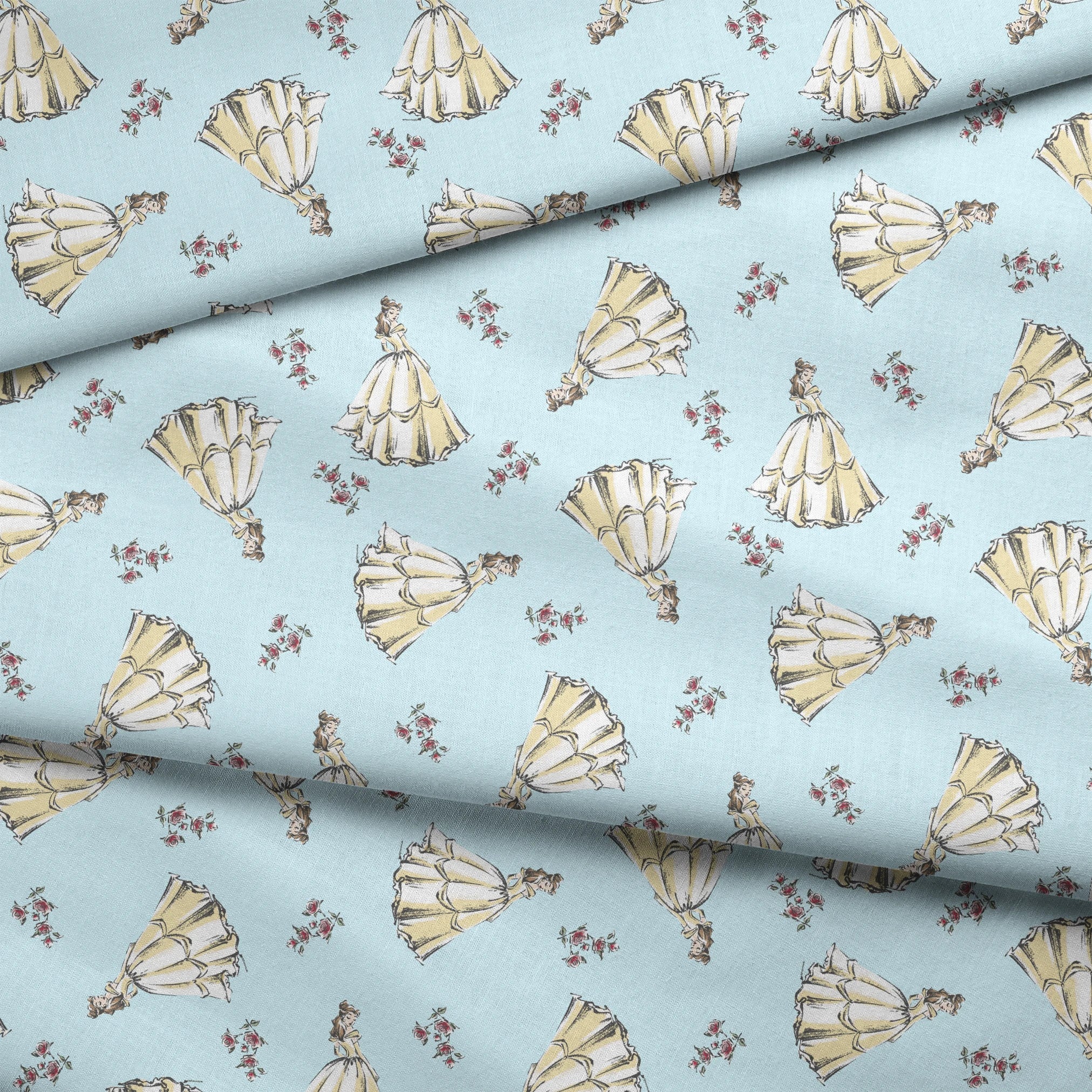 Light yellow pleated bell-shaped objects with small pink floral accents scattered on pale blue background fabric fold mockup
