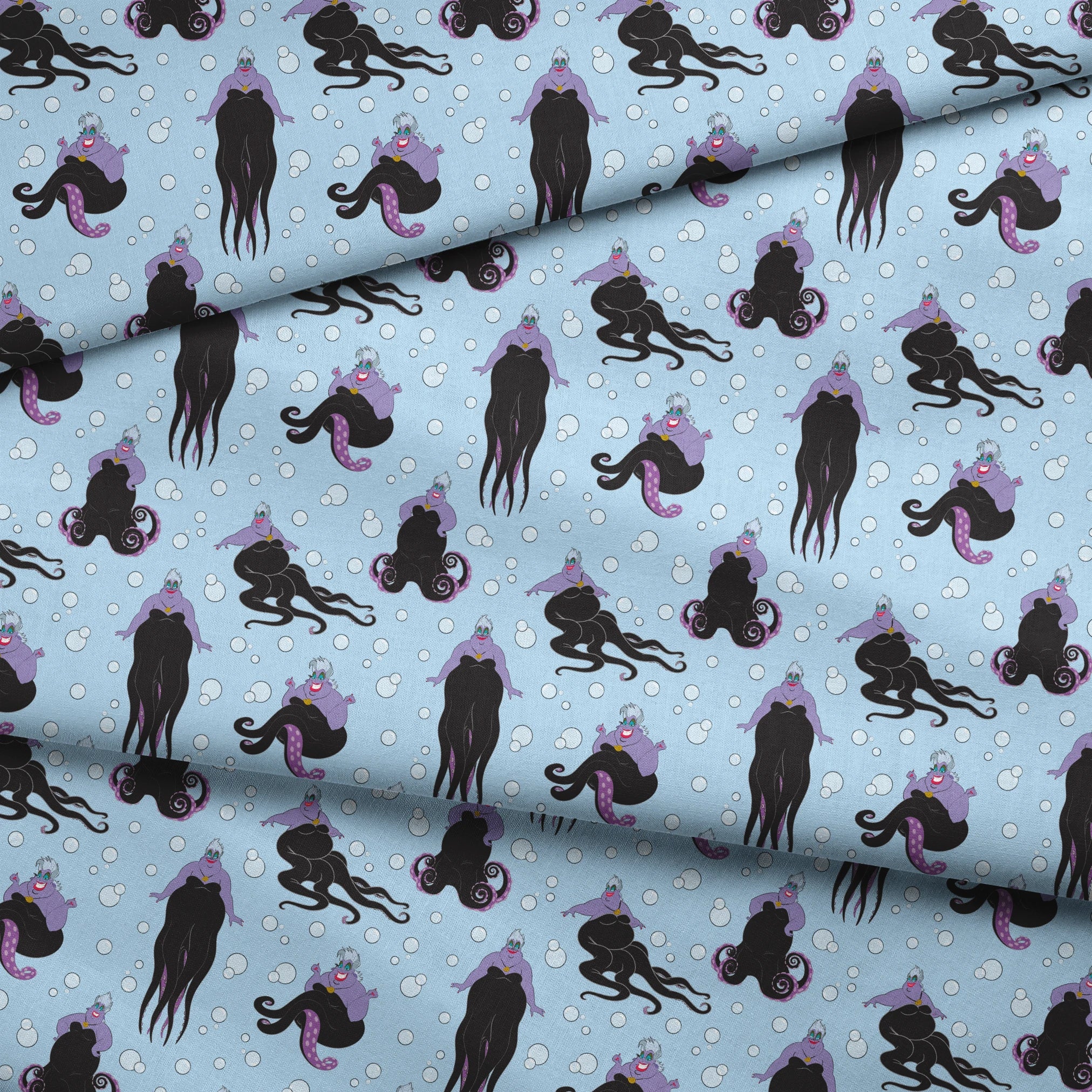 Ursula with black tentacles swimming in a light blue underwater scene with white bubbles fabric fold mockup