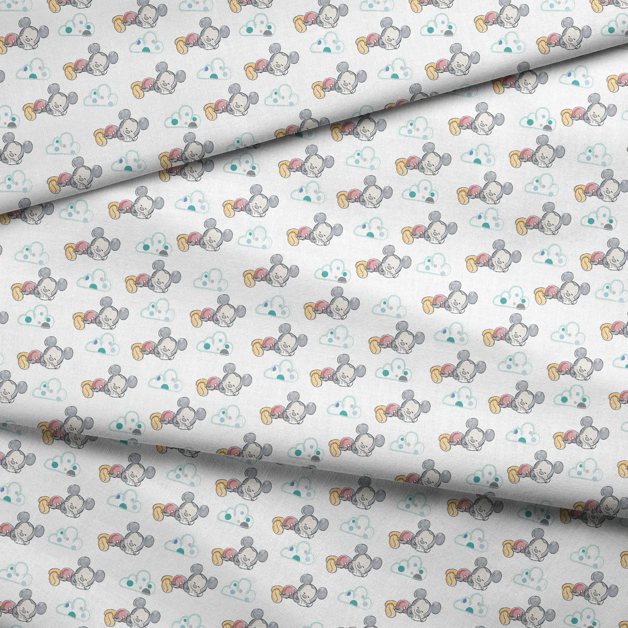 Cute cartoon mouse characters sleeping peacefully on white background with mint green clouds pattern fabric fold mockup