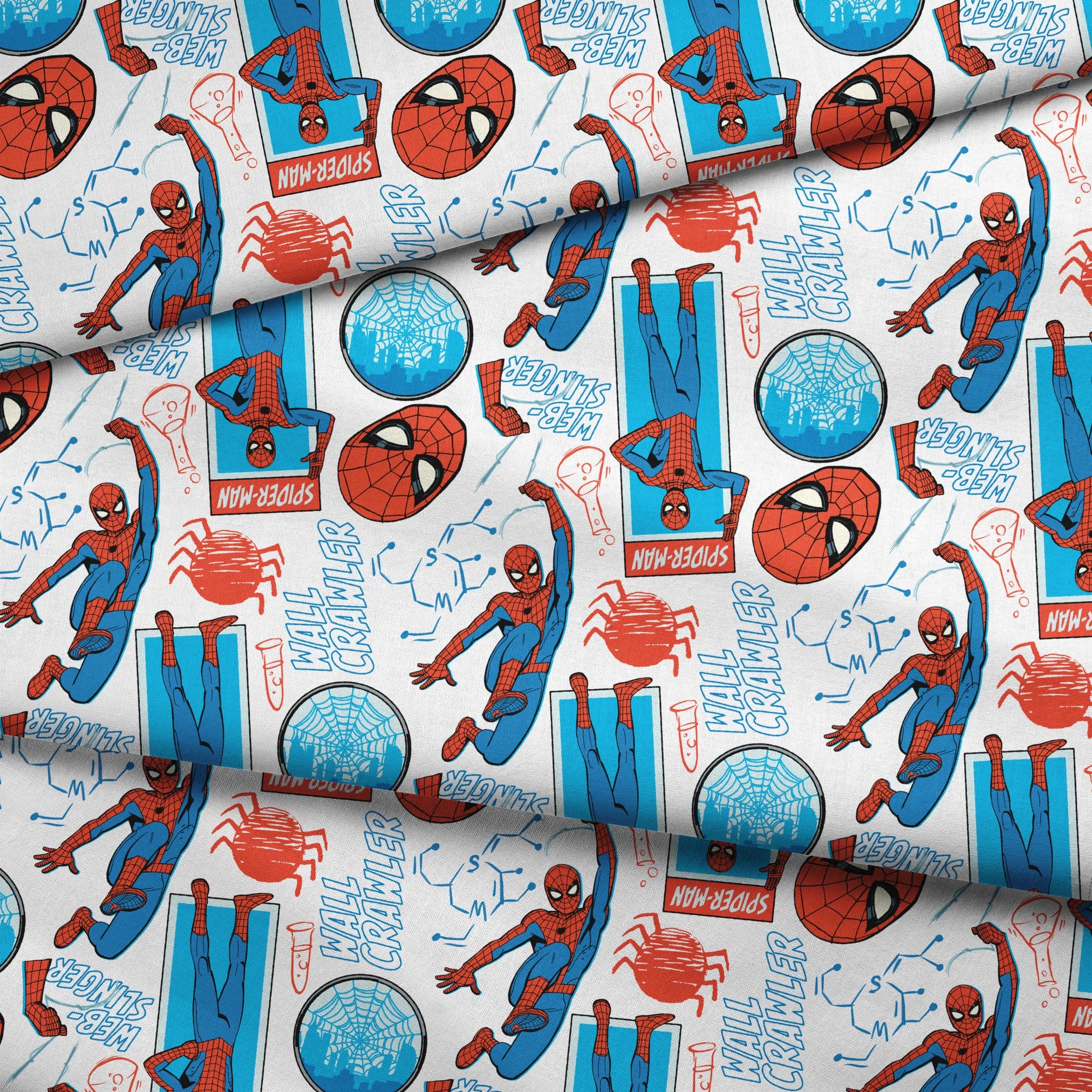 Comic-style Spider-Man pattern with red and blue figures in various poses, spider symbols, and text on white background fabric fold mockup