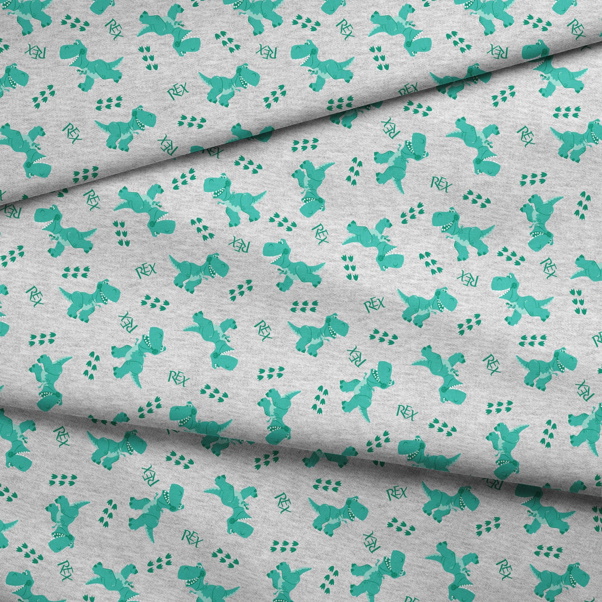 Playful Toy Story' Rex pattern on light gray heathered background fabric fold mockup