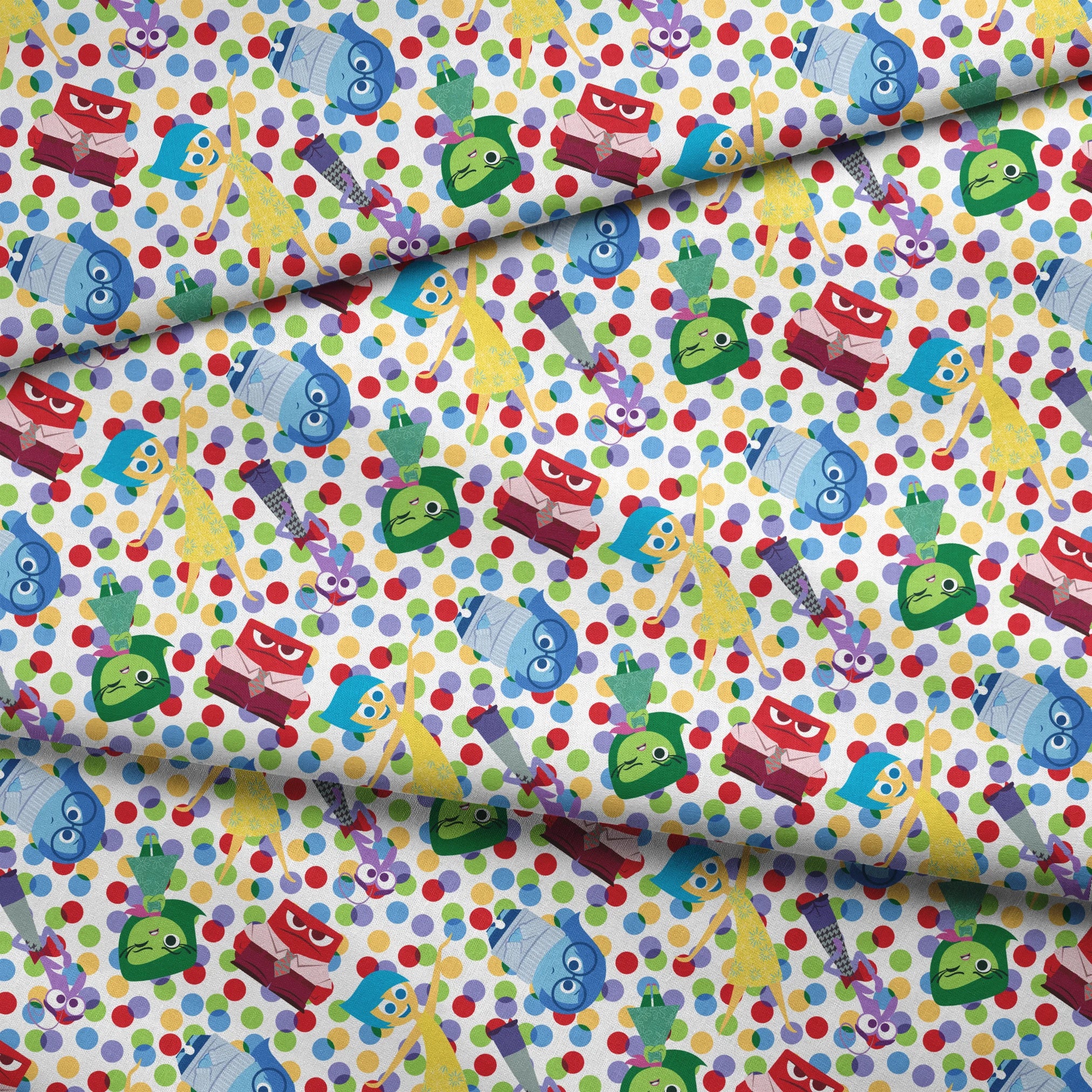 Colorful pattern of animated character heads from Inside Out movie on polka dot background fabric fold mockup