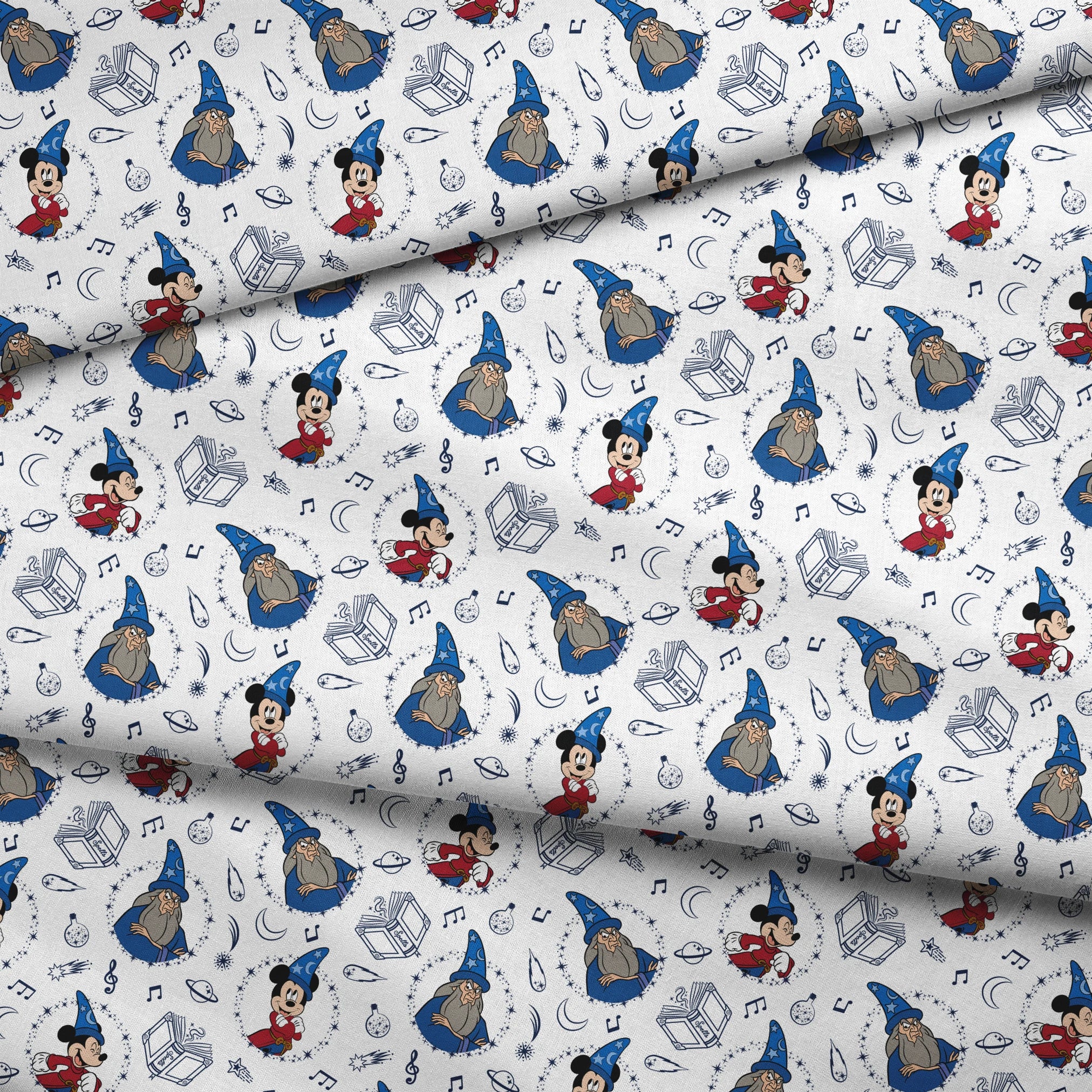 Disney's Fantasia pattern with Mickey Mouse in wizard hat, magical books, music notes, celestial elements on white background fabric fold mockup