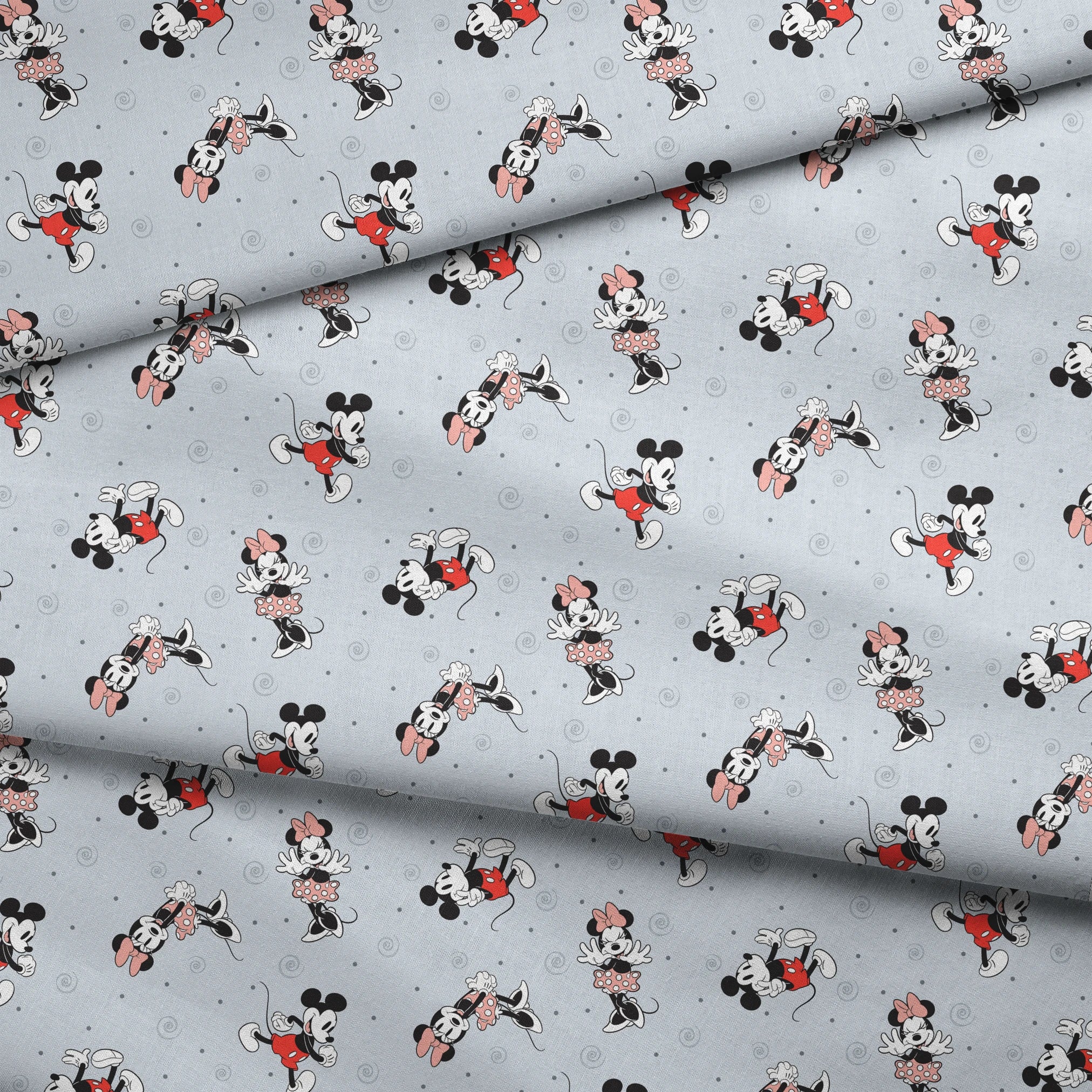 Classic Minnie and Mickey Mouse pattern with characters in various poses on light blue background with swirls fabric fold mockup