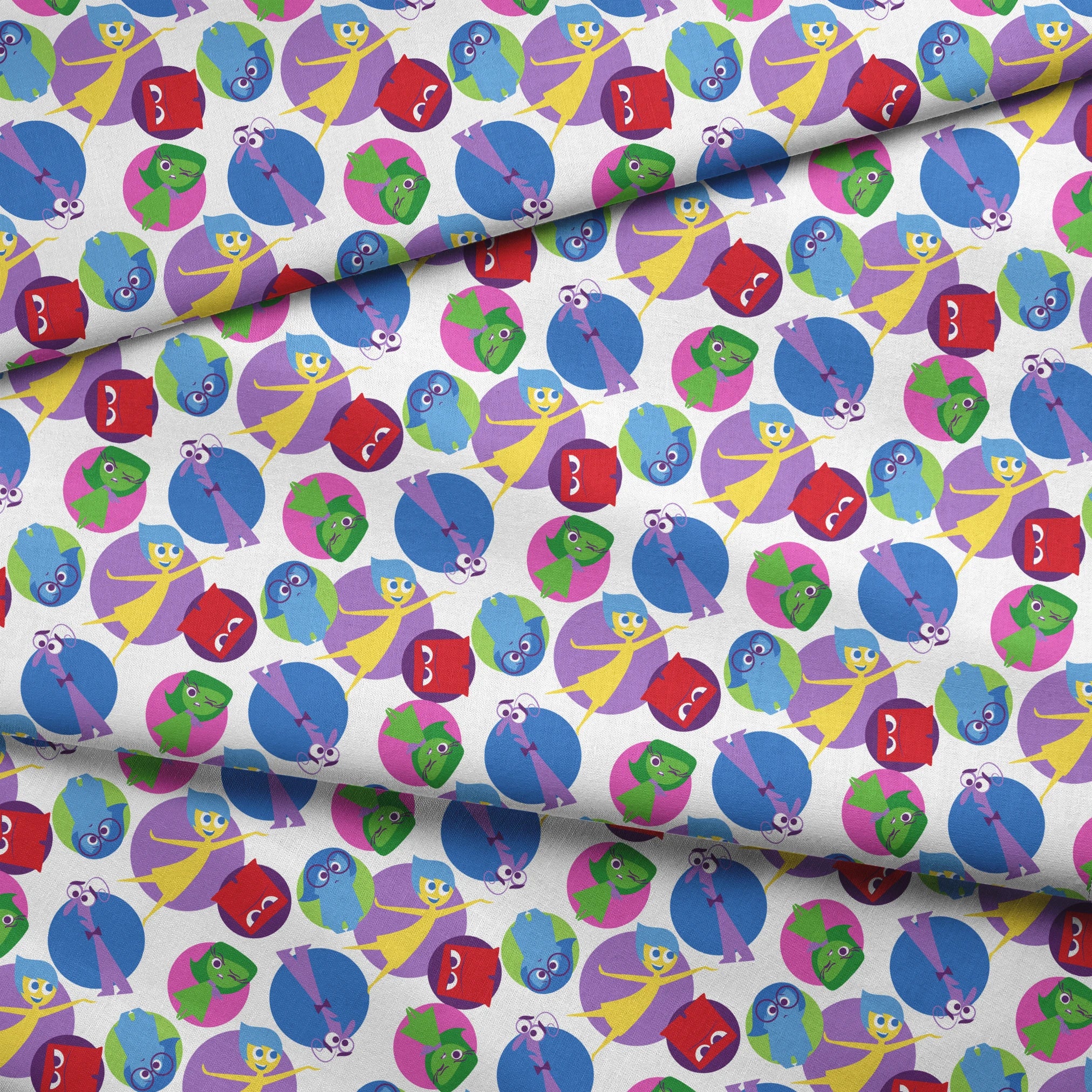 Colorful pattern of Inside Out characters with expressive eyes in overlapping purple, blue, red, and green circles fabric fold mockup
