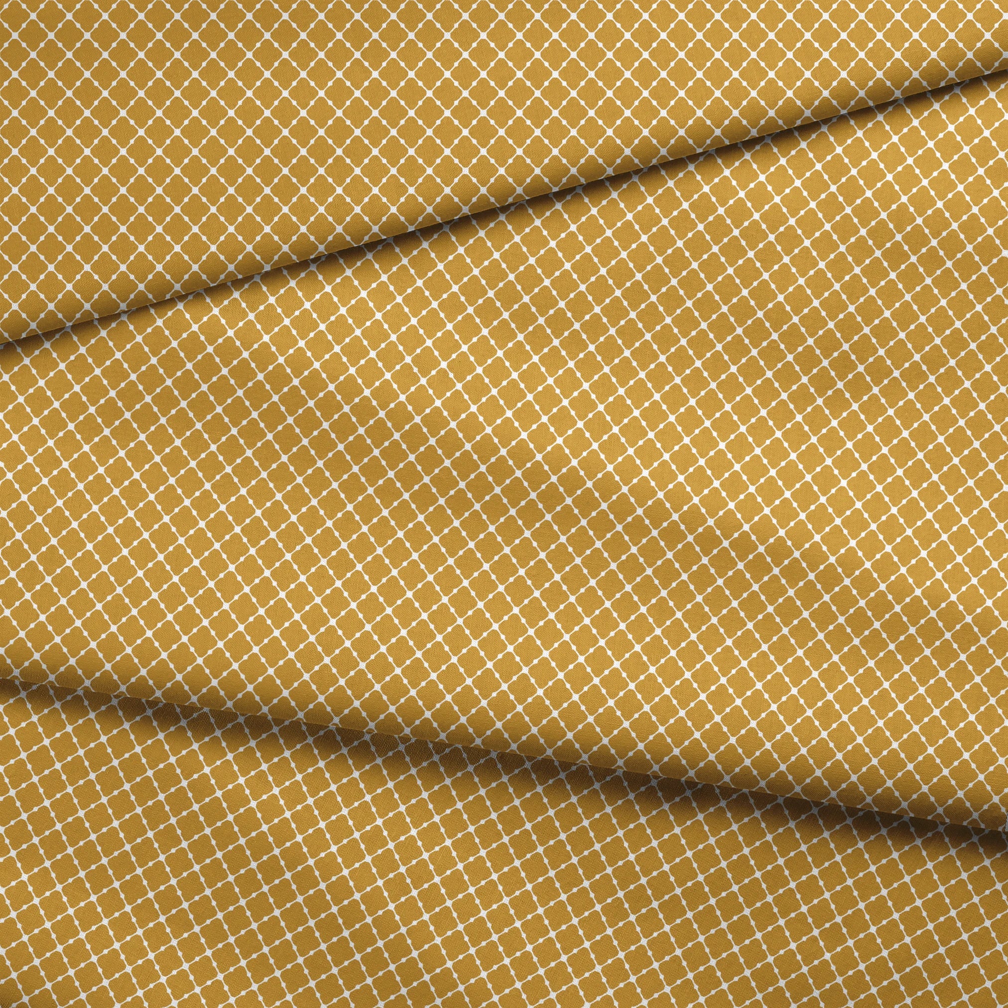 Gold quatrefoil pattern on white background, forming a geometric Moroccan-style lattice design fabric fold mockup