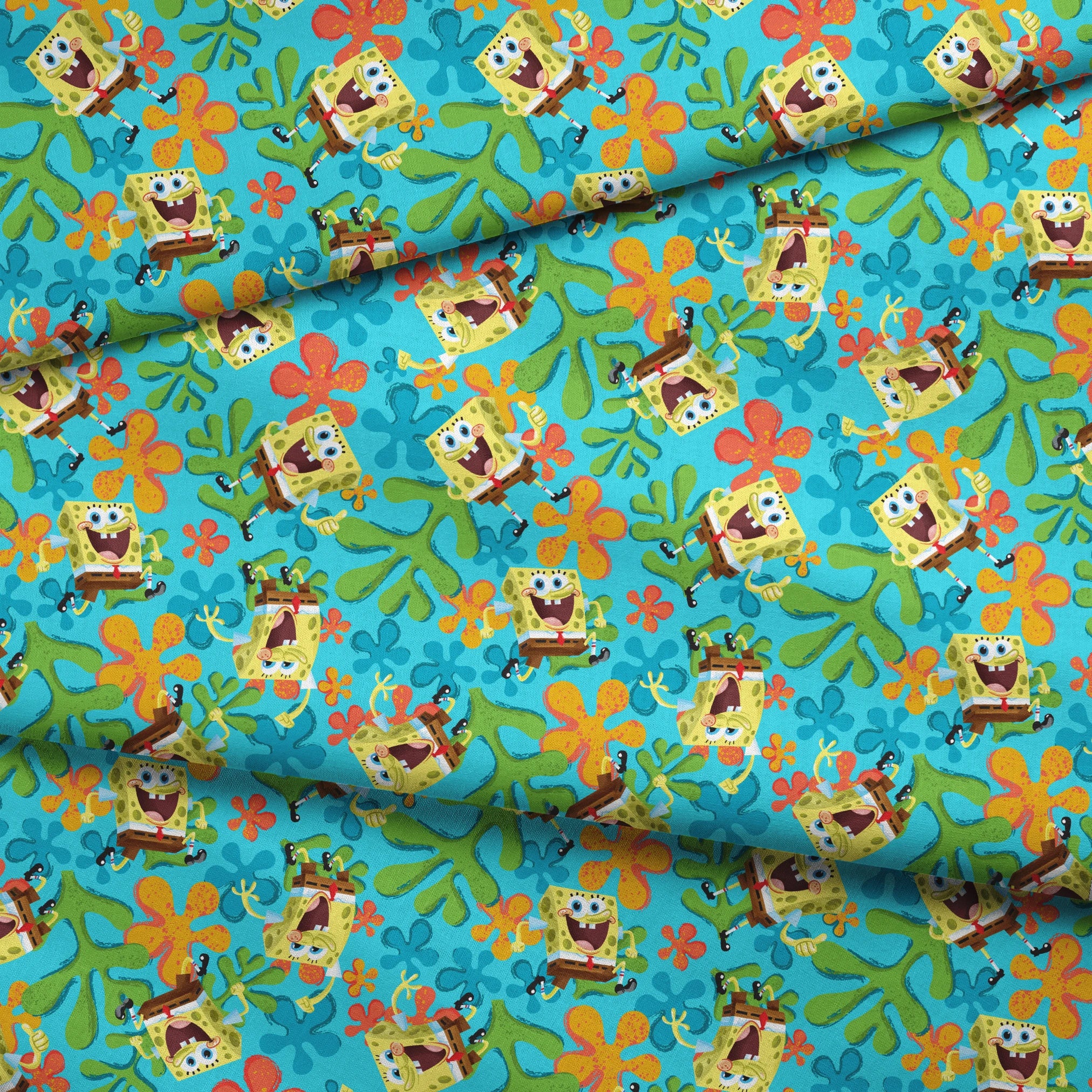 SpongeBob SquarePants pattern with colorful orange and blue flowers on turquoise background fabric fold mockup