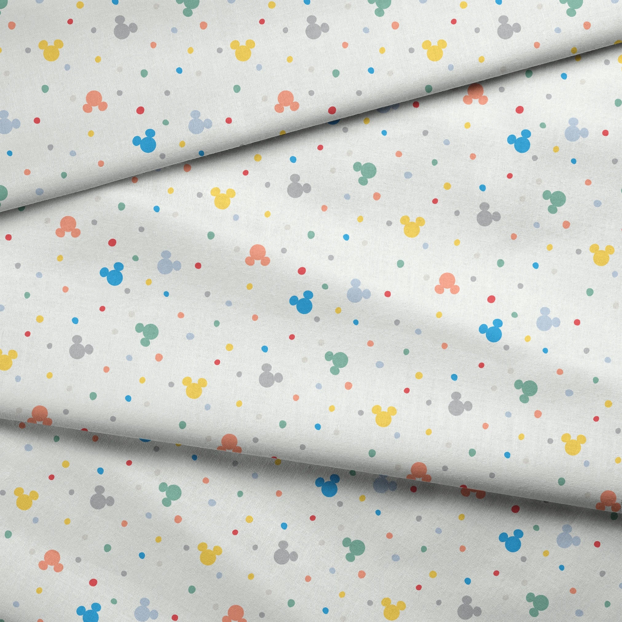 Colorful Disney Mickey Mouse silhouette pattern with pastel dots on white background fabric fold mockup