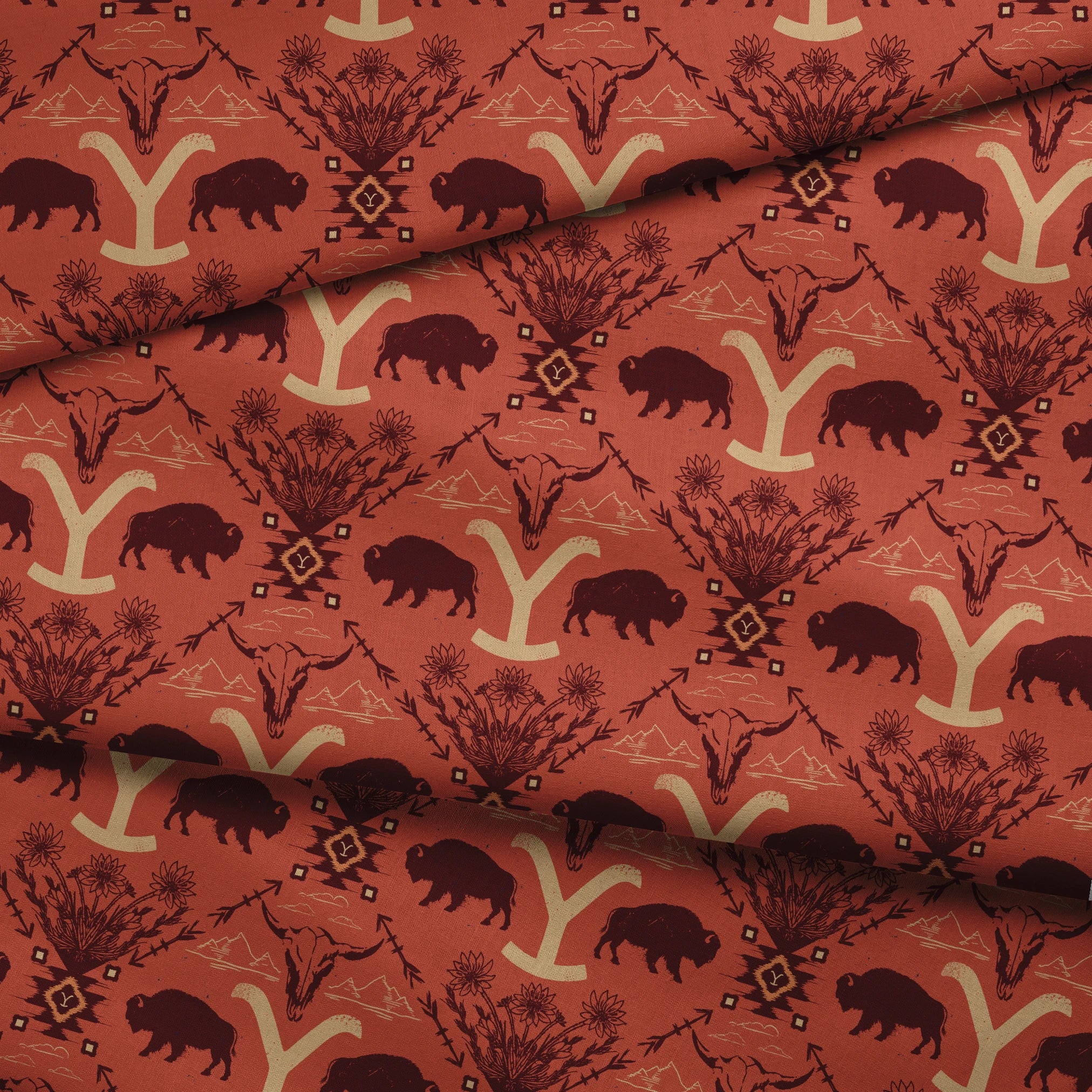Terracotta and burgundy Yellowstone design with buffalo, skulls, wildflowers, and Western motifs. fabric fold mockup