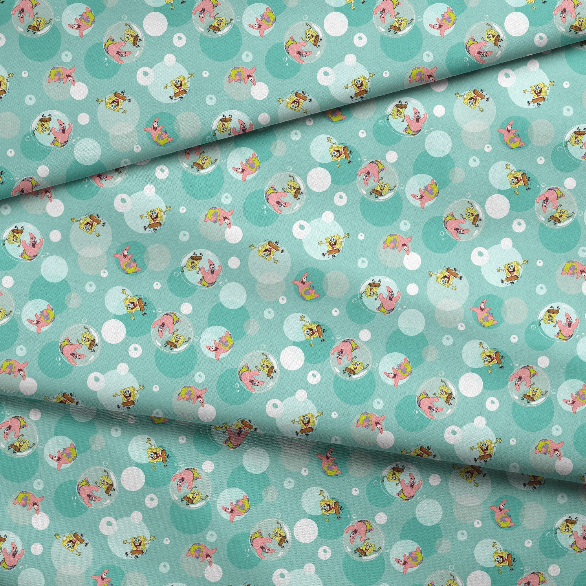 SpongeBob and Patrick floating in transparent bubbles across a seafoam green background with layered circle accents. fabric fold mockup