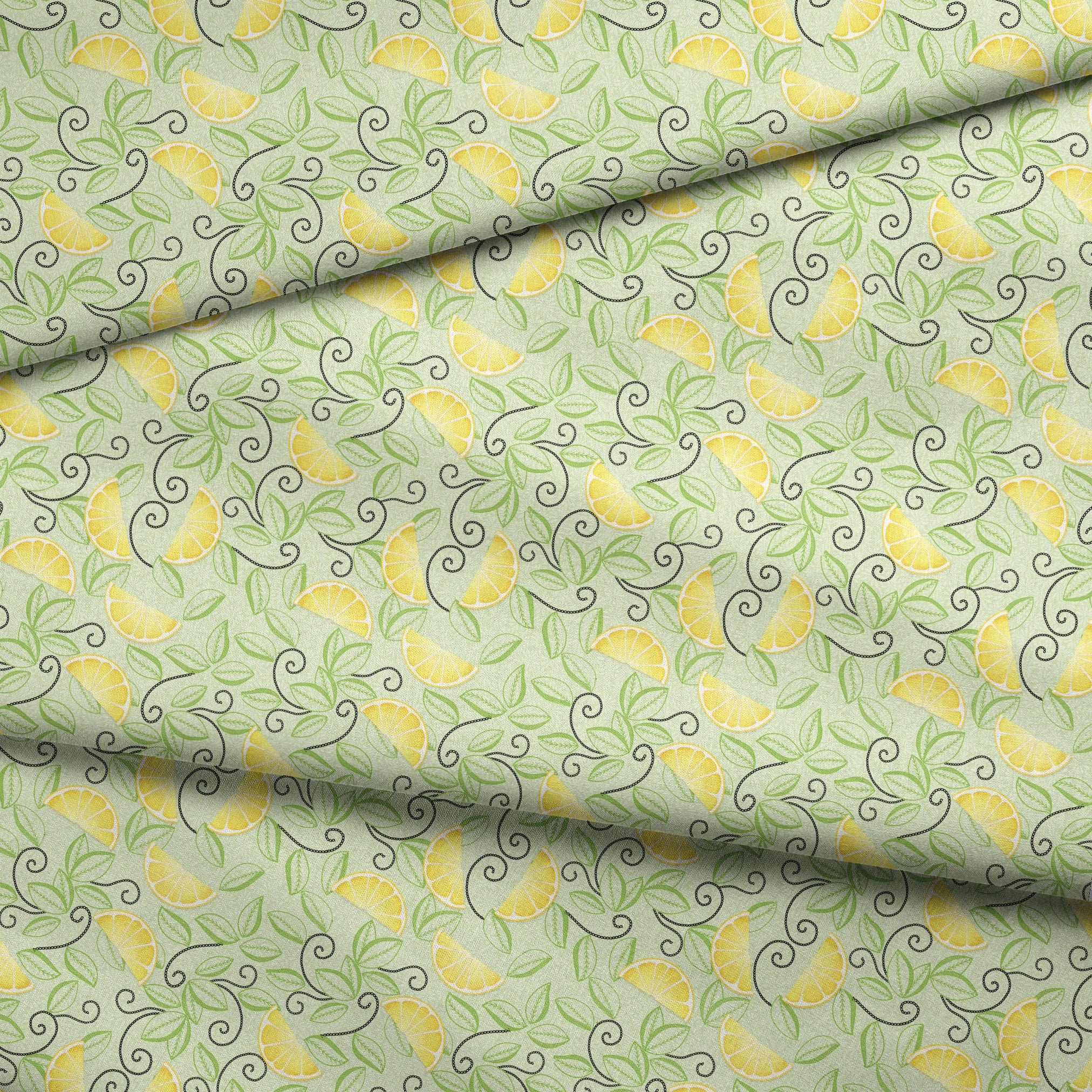 Yellow lemon slices with swirling green leaves on a soft green background in a playful, fresh layout. fabric fold mockup