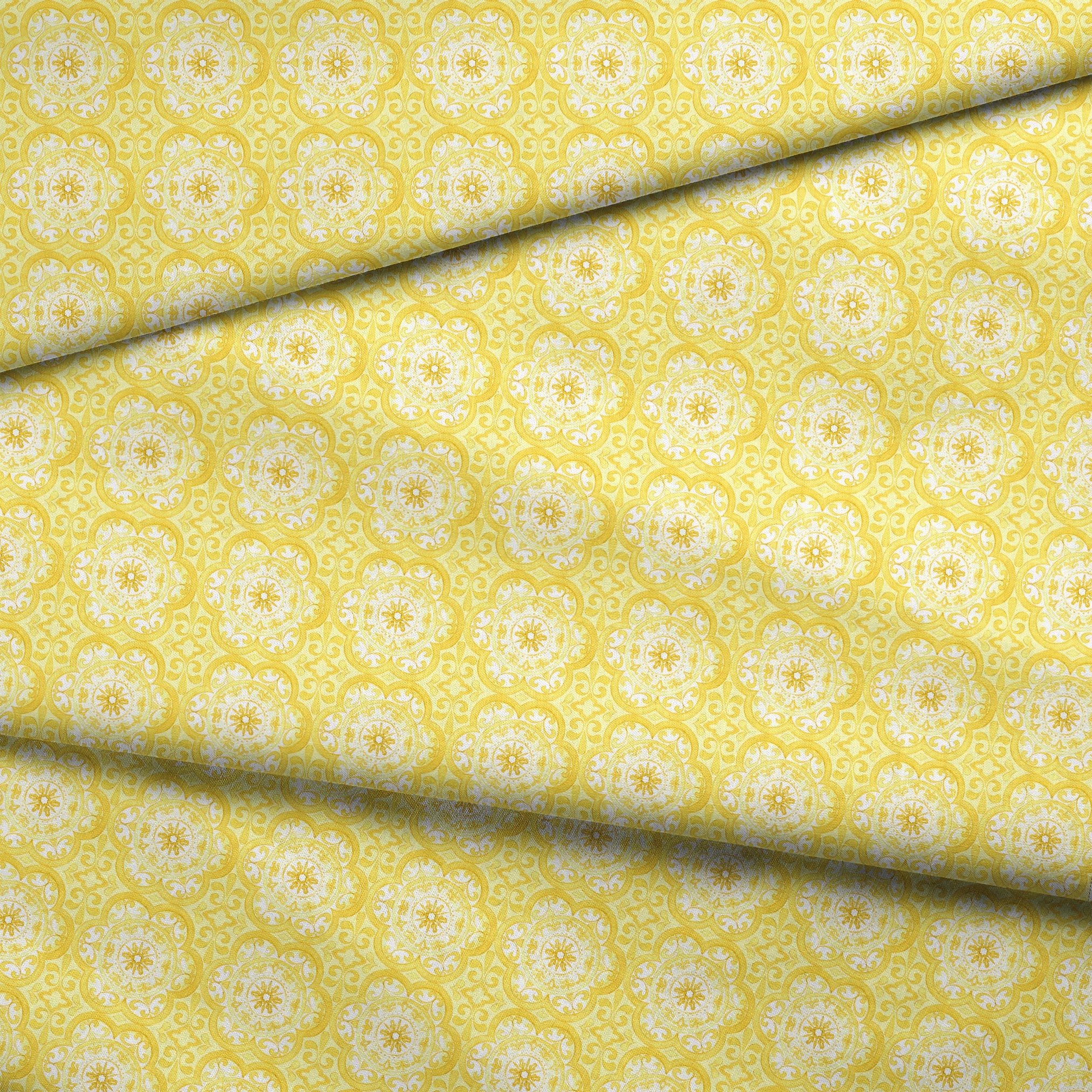 Bright yellow decorative pattern with white floral medallions in repeating ornamental design fabric fold mockup