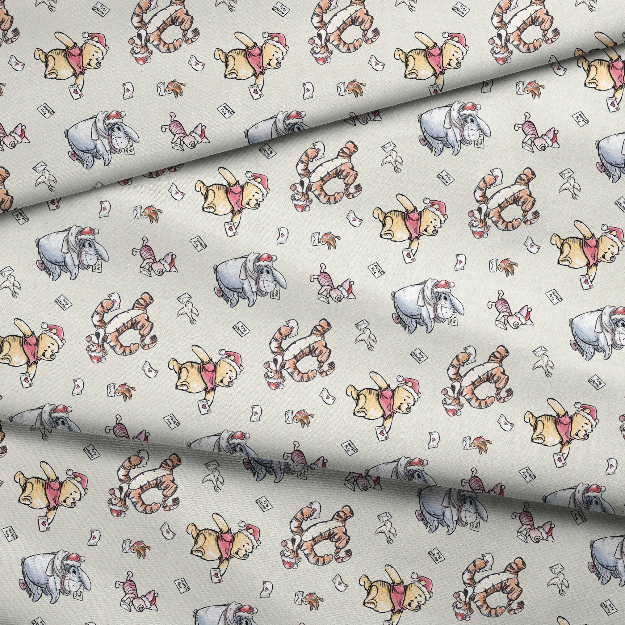 Whimsical cartoon characters in Santa hats on cream background with scattered letters fabric fold mockup