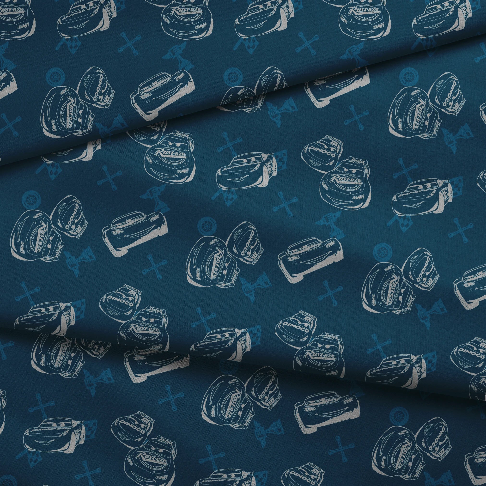 Race cars pattern on dark blue background with sketched vehicles and tire marks fabric fold mockup