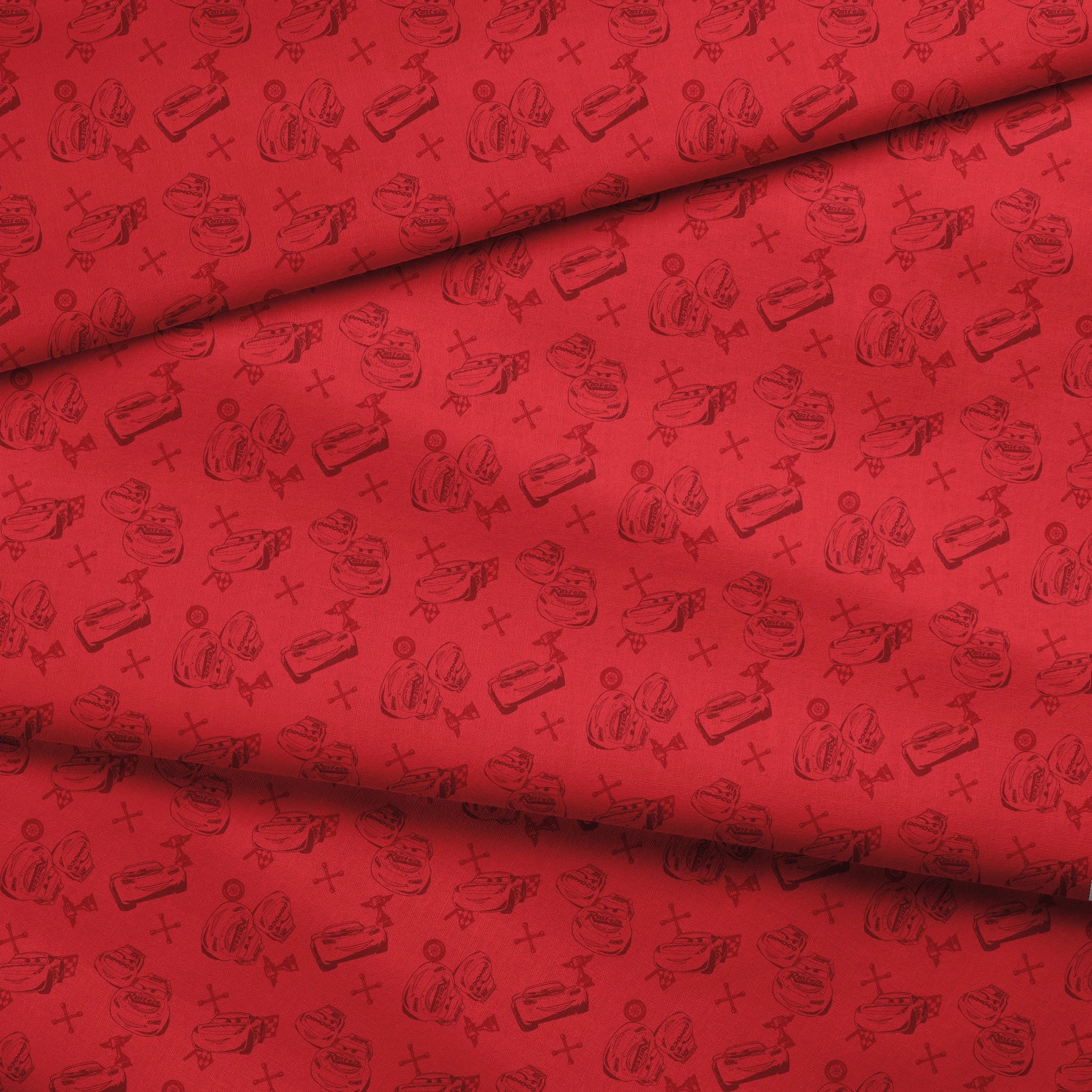 Red background with hand-drawn cartoon cars, tires, and tools in a repeating pattern fabric fold mockup