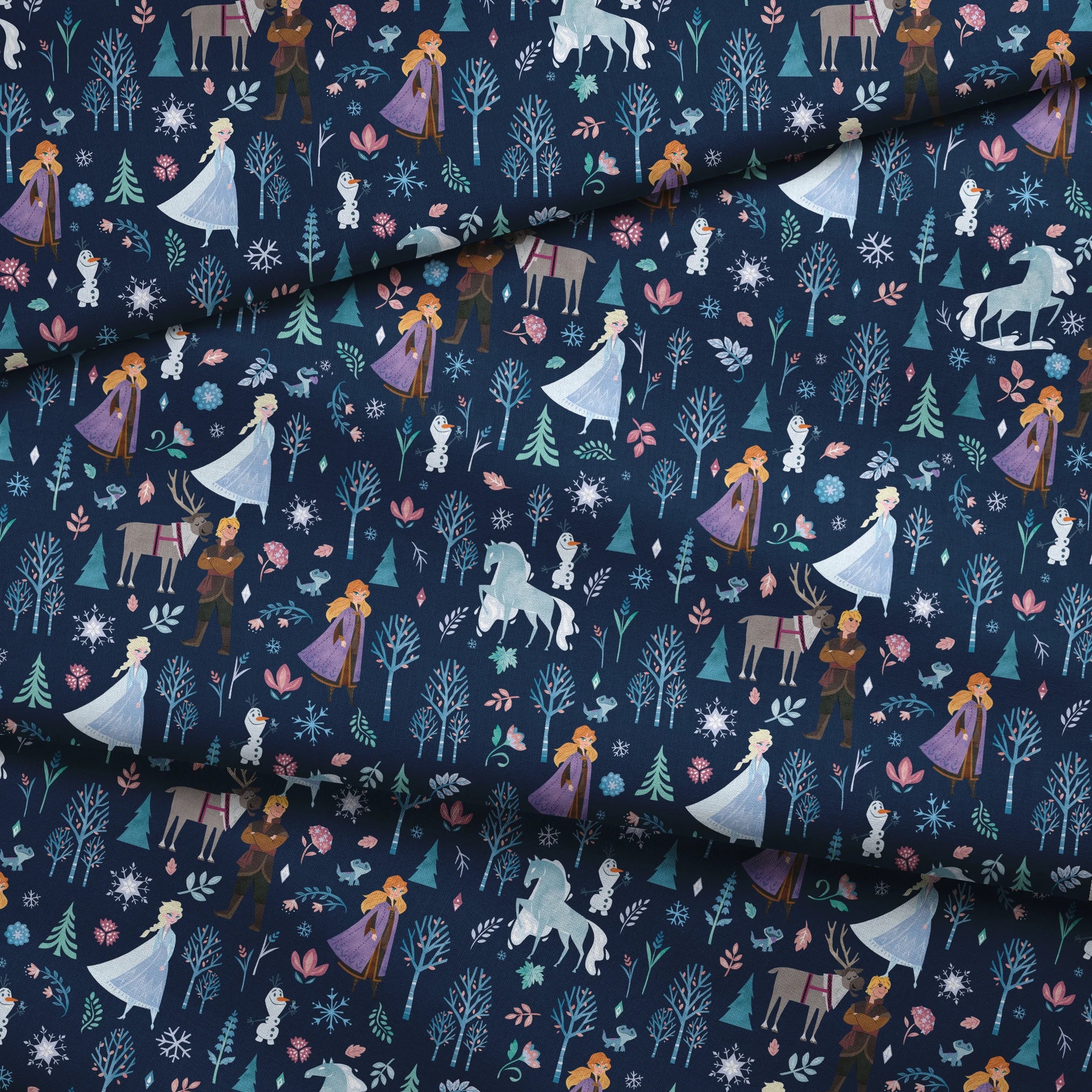 Illustrated Frozen pattern with Elsa, Anna, & friends, and floral elements on dark blue background fabric fold mockup